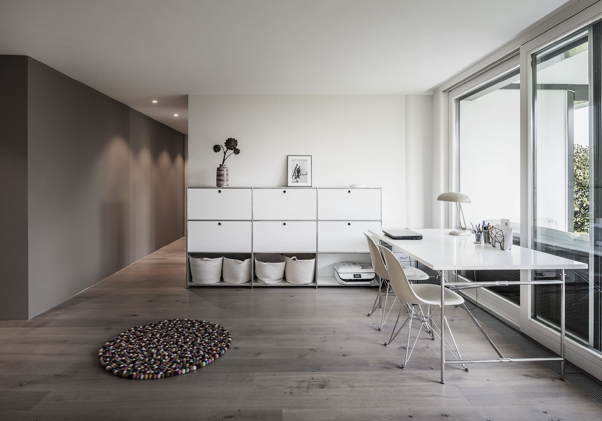 Work area with sideboard and desk by the window – Interiors and landscape, Kilchberg