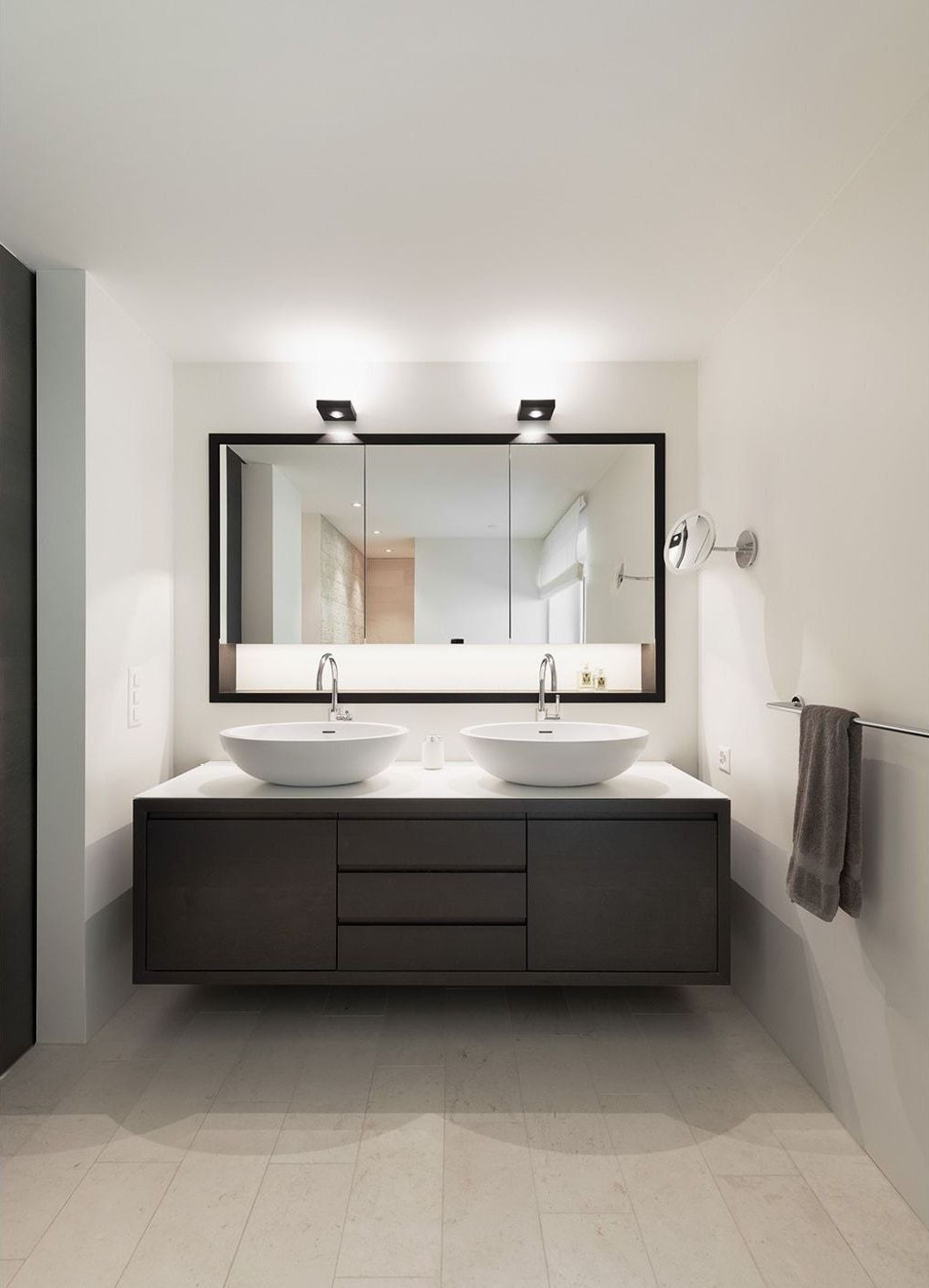 Bathroom with double vanity and illuminated mirror – Interiors and landscape, Stallikon