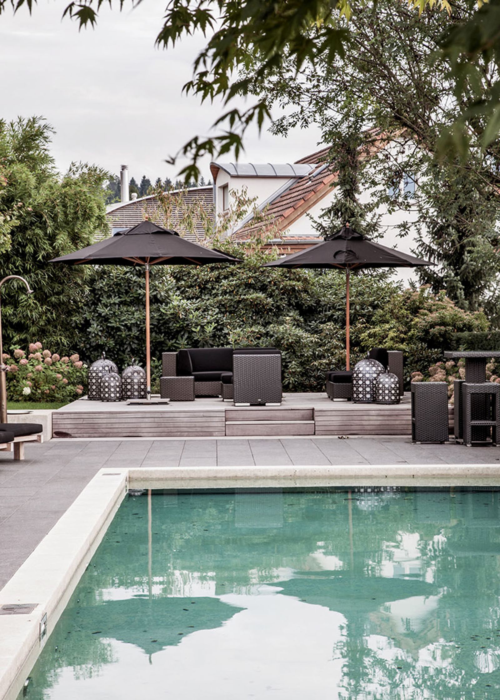 Pool with parasols in the garden