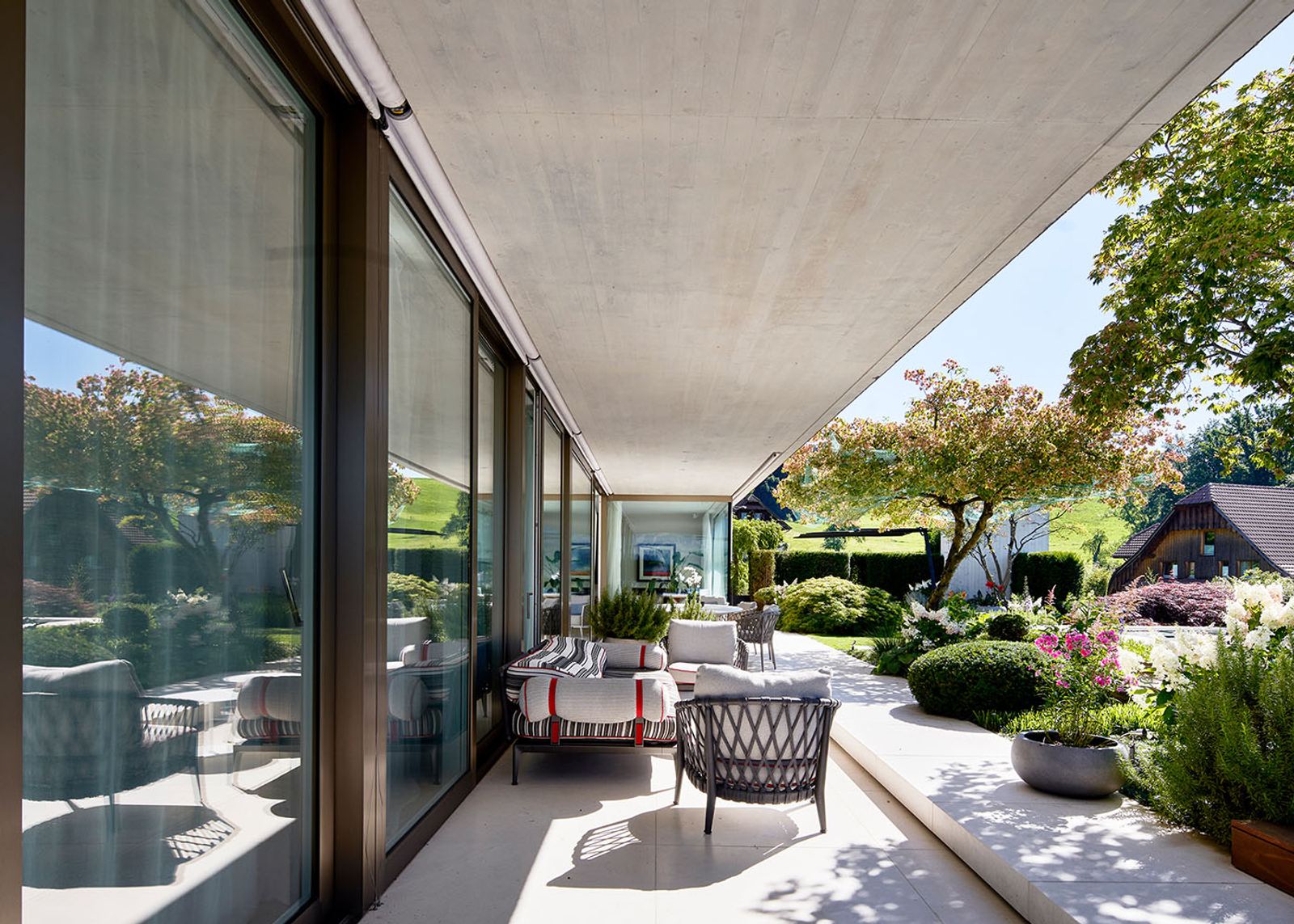 Terrace under the canopy along the glass front