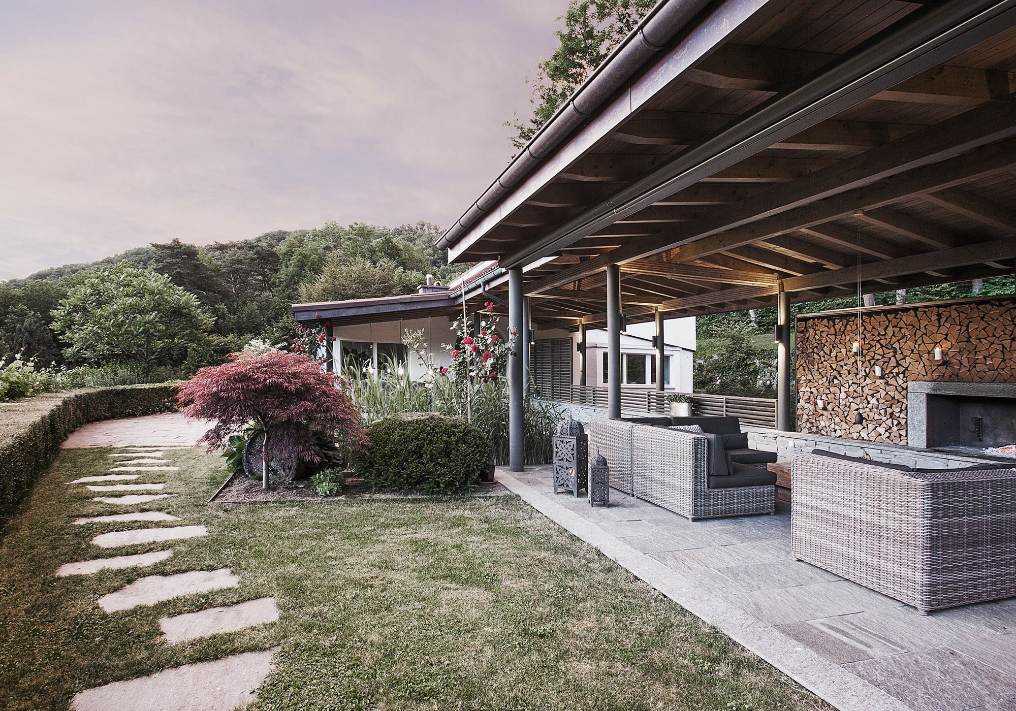 Stepping stones leading to the covered outdoor room – Interiors and landscape, Stallikon