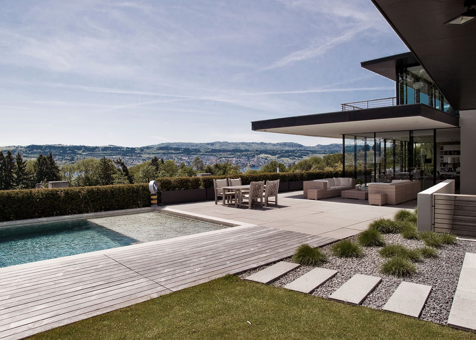 Pool with timber deck and wide view