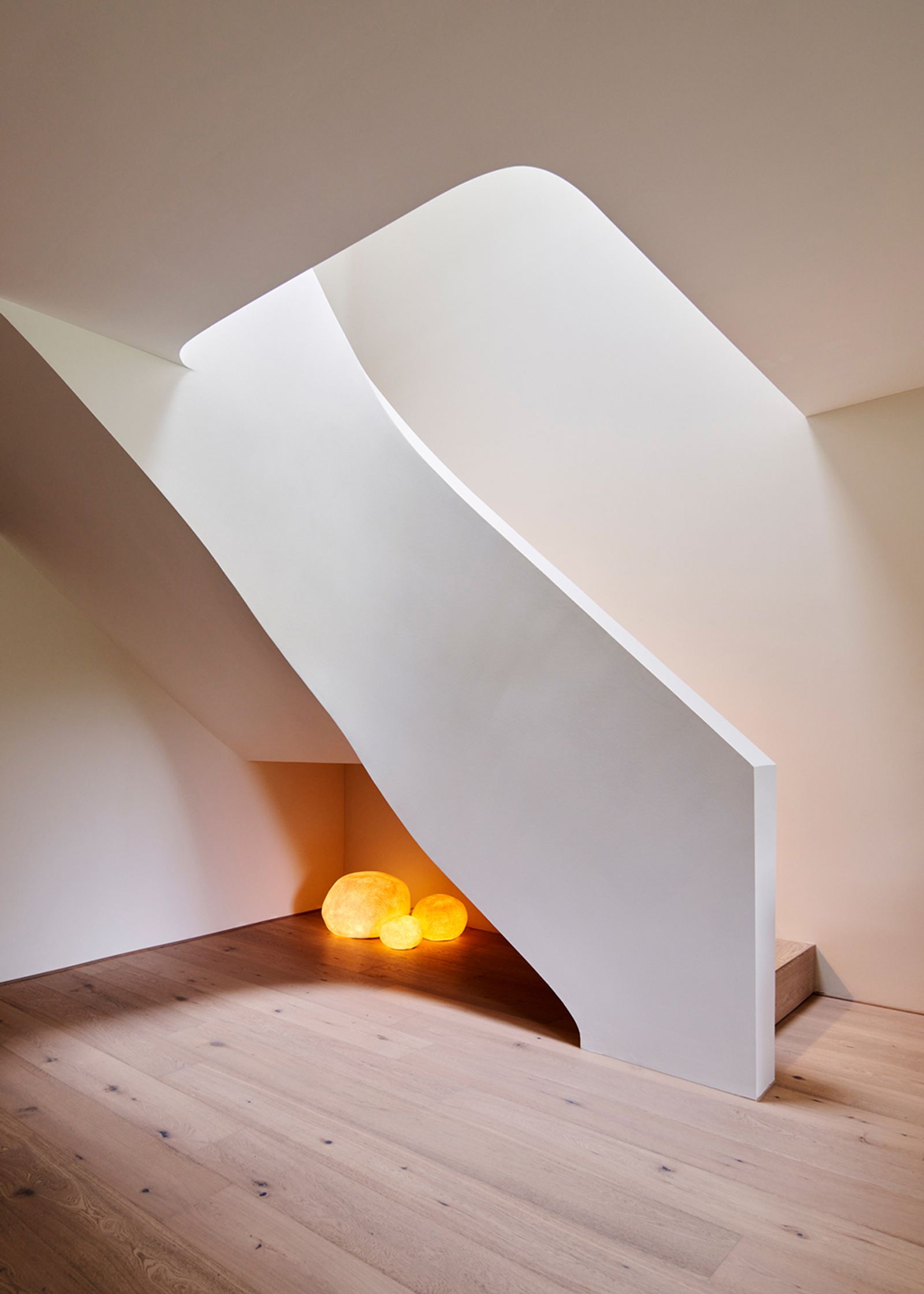 White stair stringer with glowing globes beneath