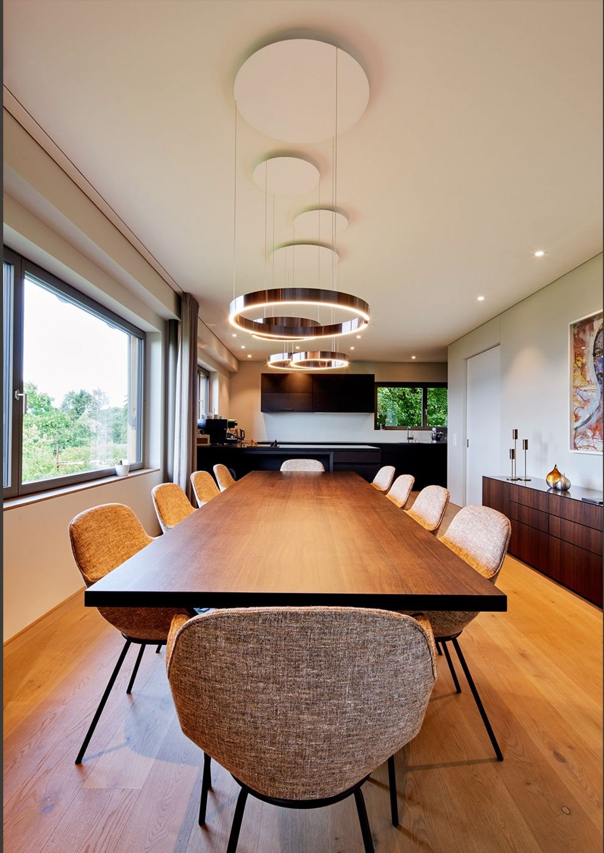 Dining table with ring pendants in front of the windows – Interiors and landscape, Meilen