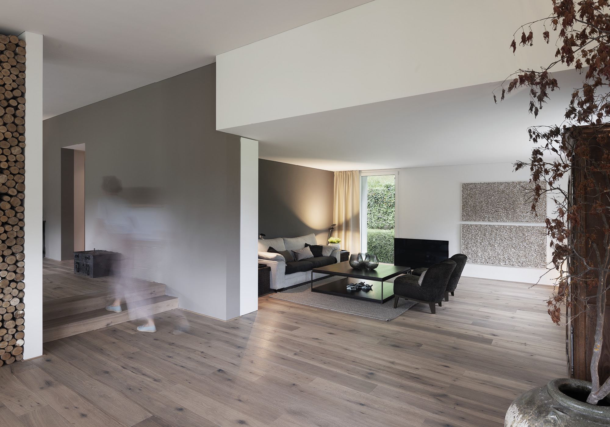 Living area with sofa and garden view – Interiors and landscape, Stallikon