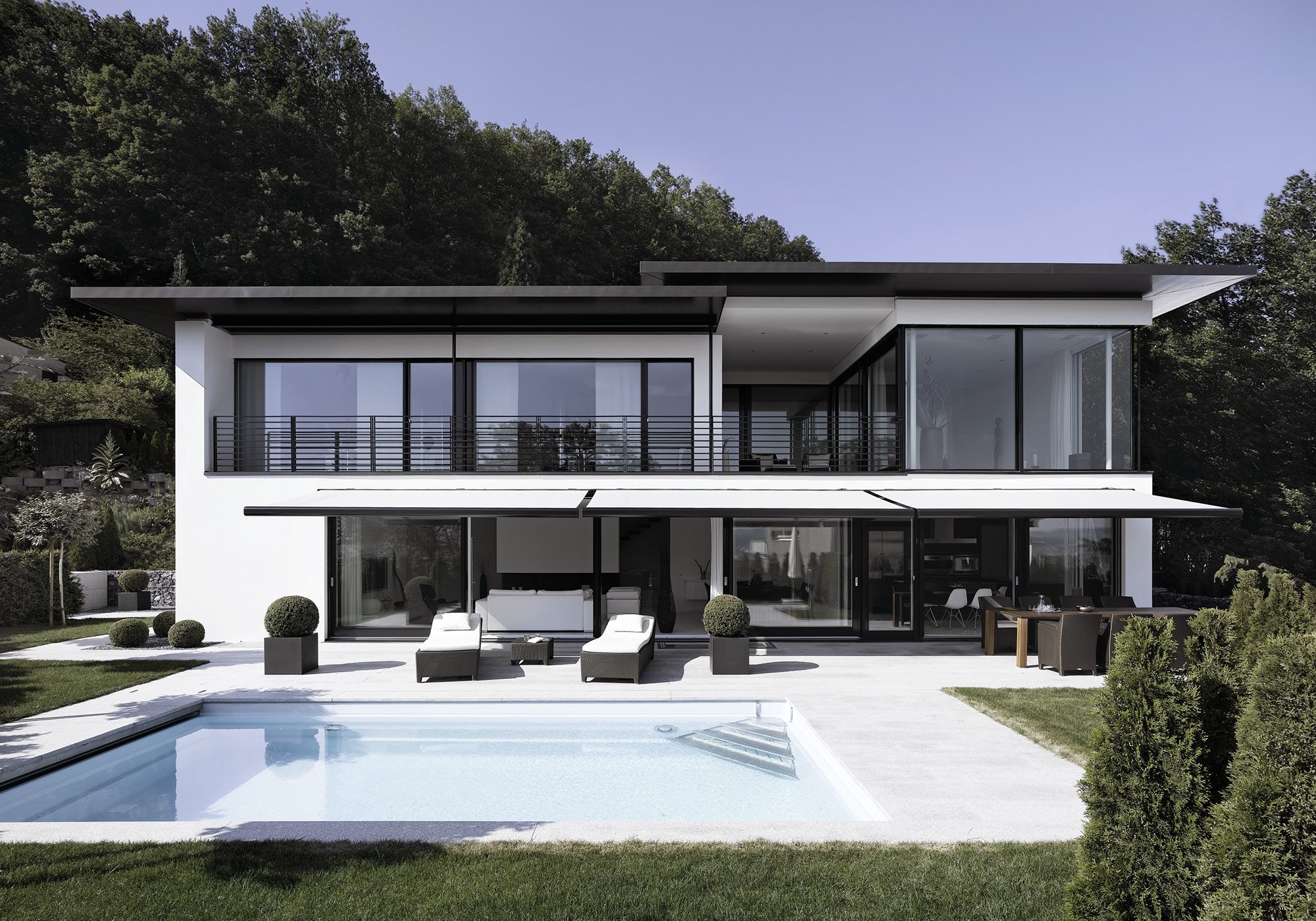 White house with pool and lawn at the edge of the forest – Single-family house in Geroldswil