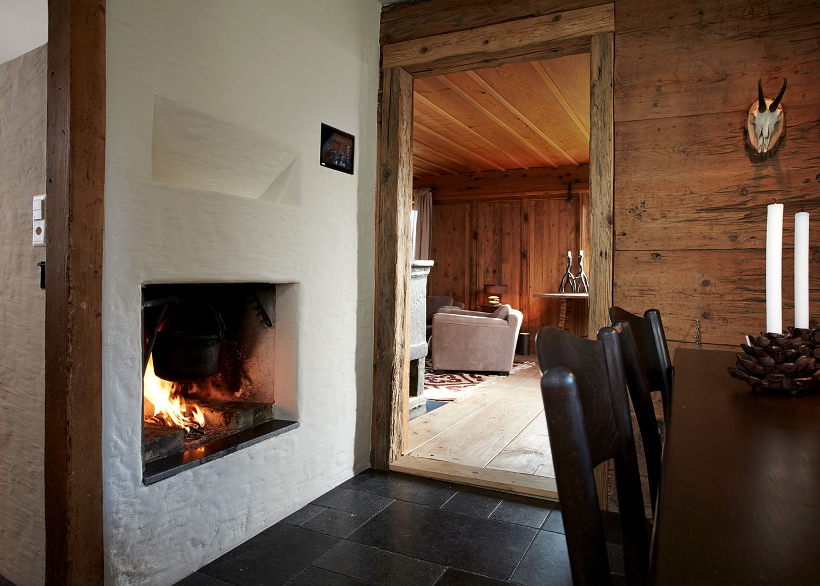 Fireplace in a white wall with reclaimed timber
