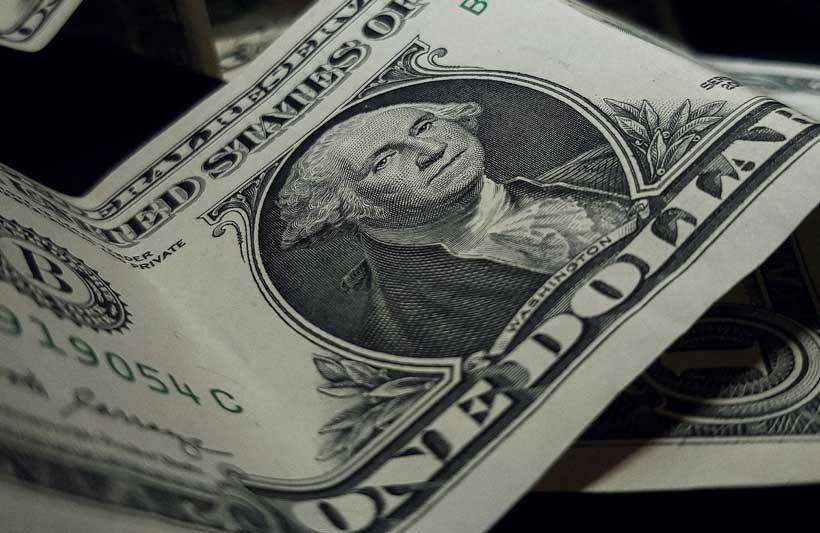 Close-up of a crumpled US one-dollar bill.