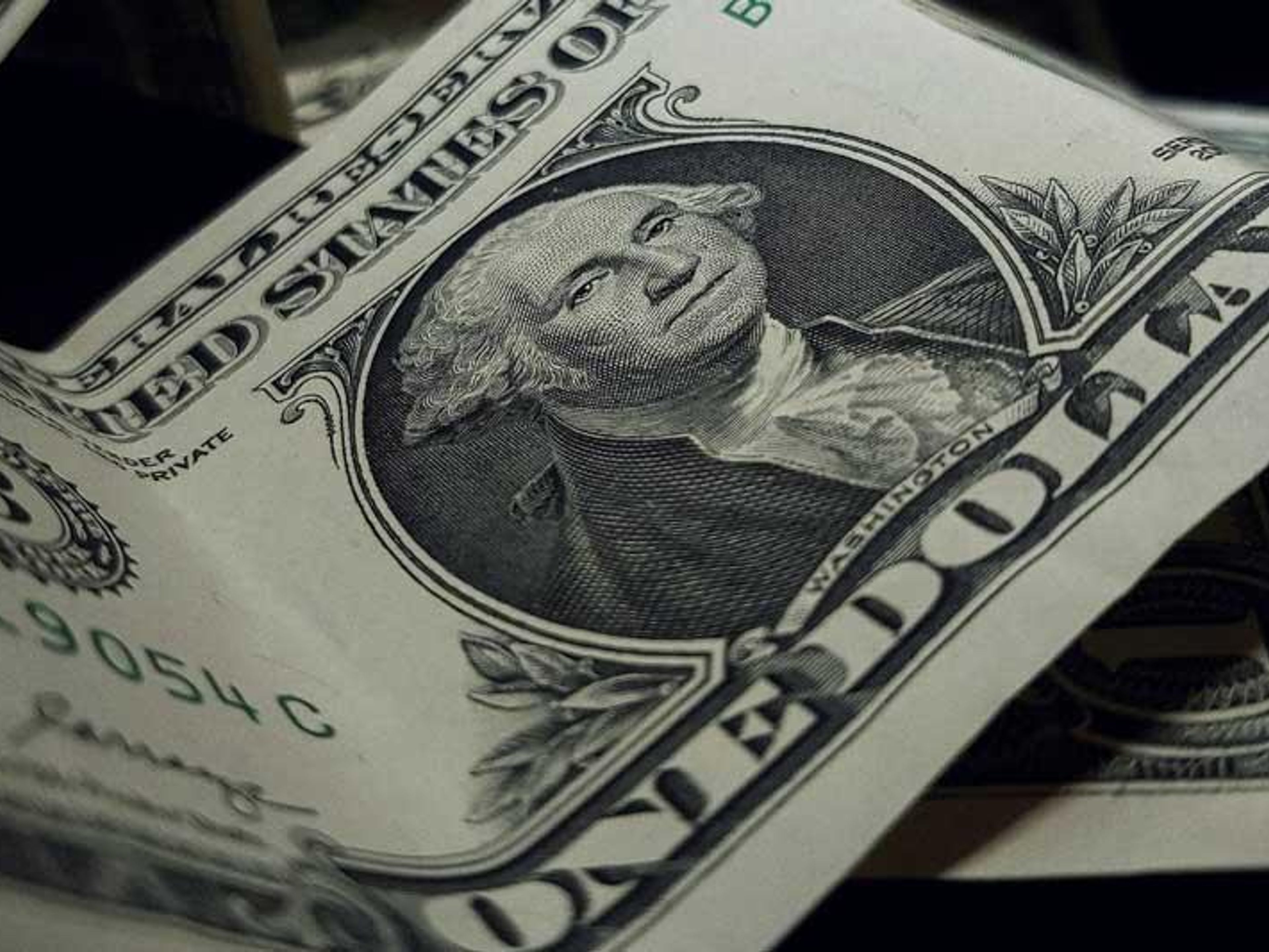 Close-up of a crumpled US one-dollar bill.