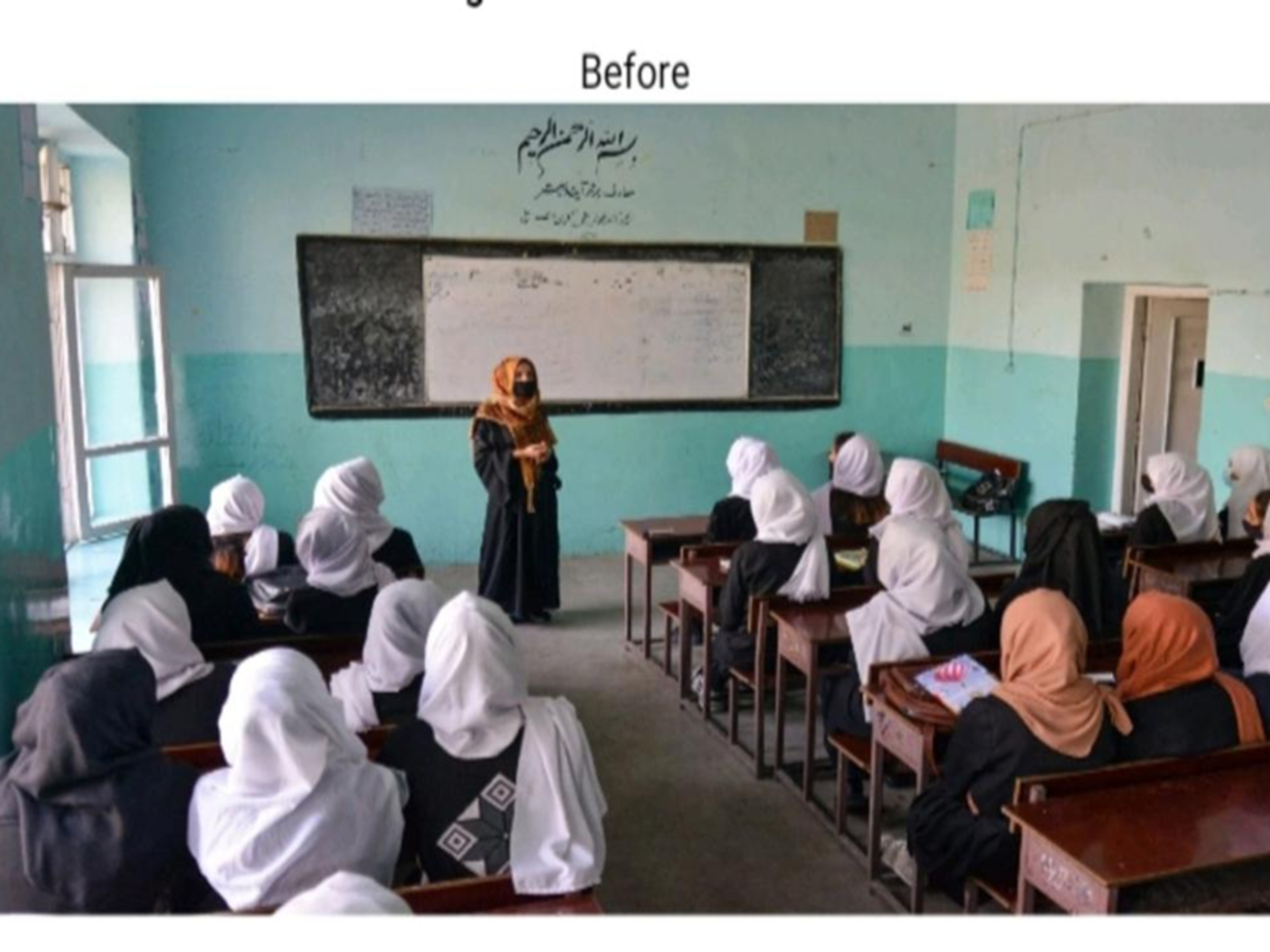 A teacher in a niqab instructs a classroom of female students wearing headscarves.