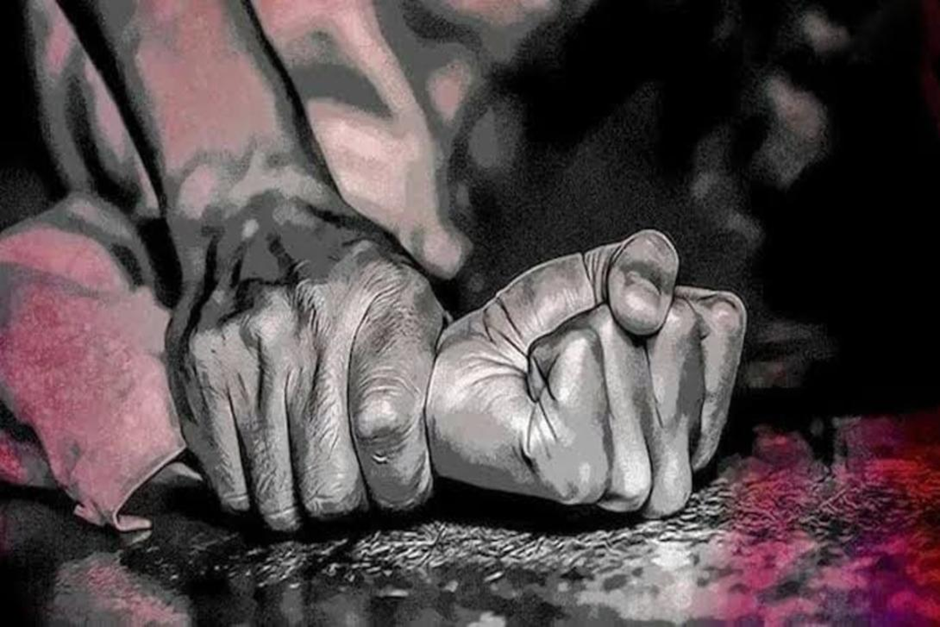 Dark image of one hand gripping a clenched fist, with red undertones.