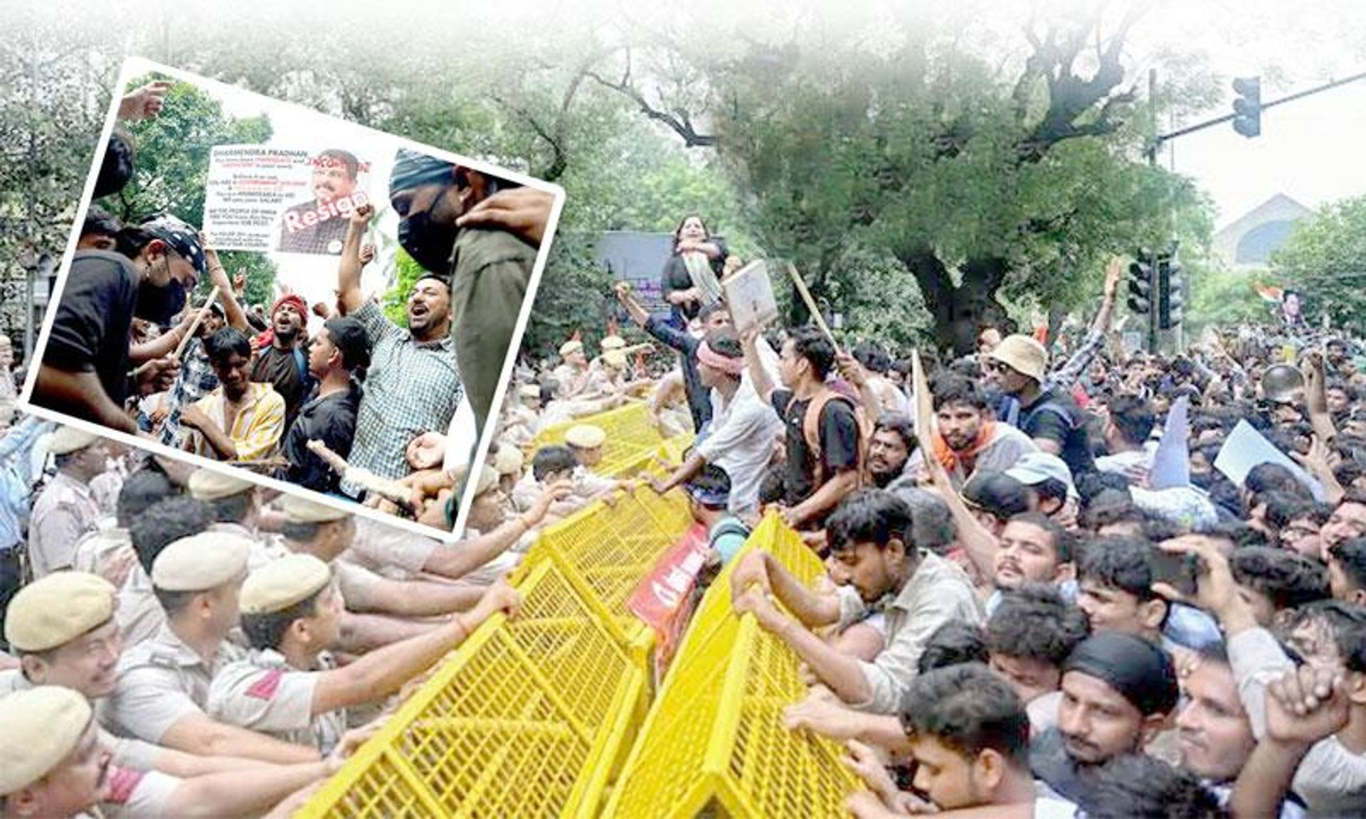 A large crowd of protestors pushes against yellow police barricades, confronting police officers, with some holding "Resign" signs.
