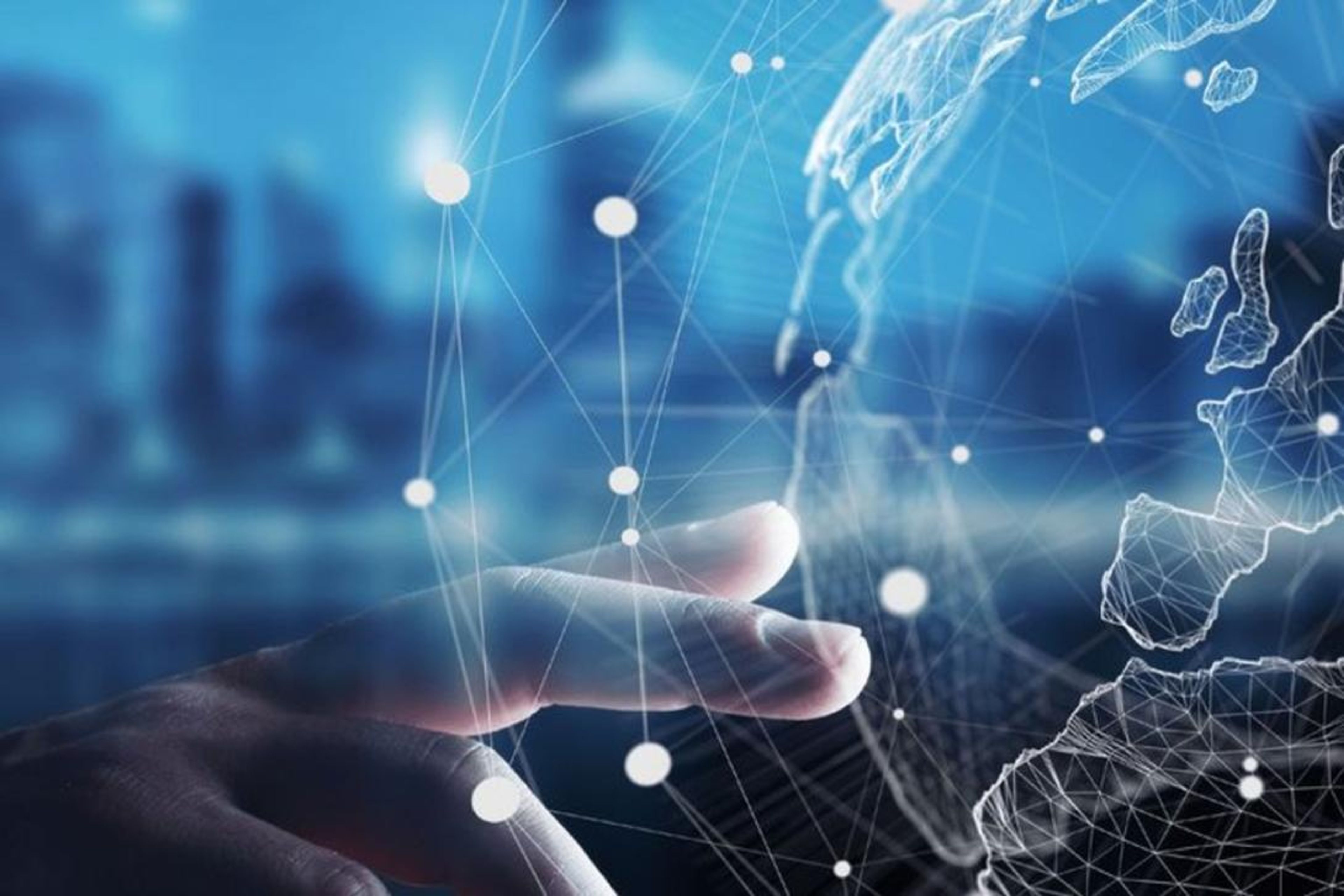 Hand interacting with a glowing digital global network and wireframe map.