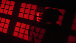 Person on beach with blue fabric