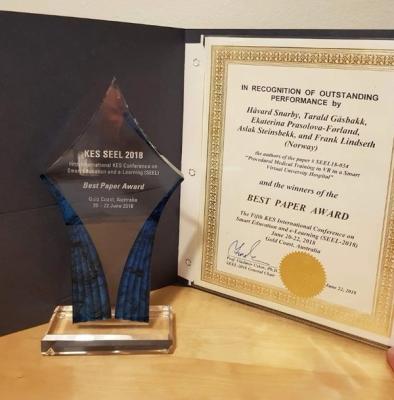 Image showing the prize and diploma for best paper award