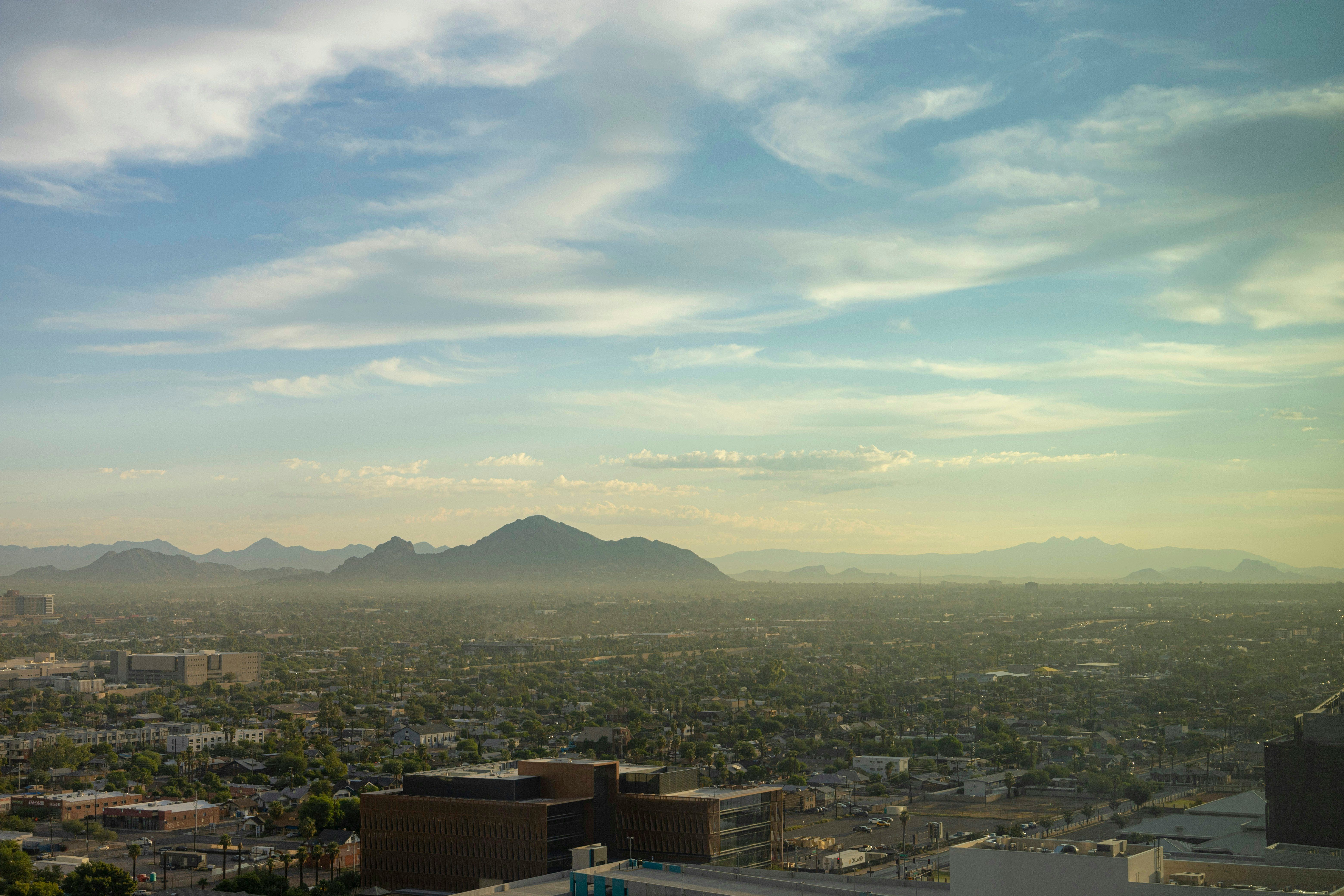 A view of a city with mountains in the background