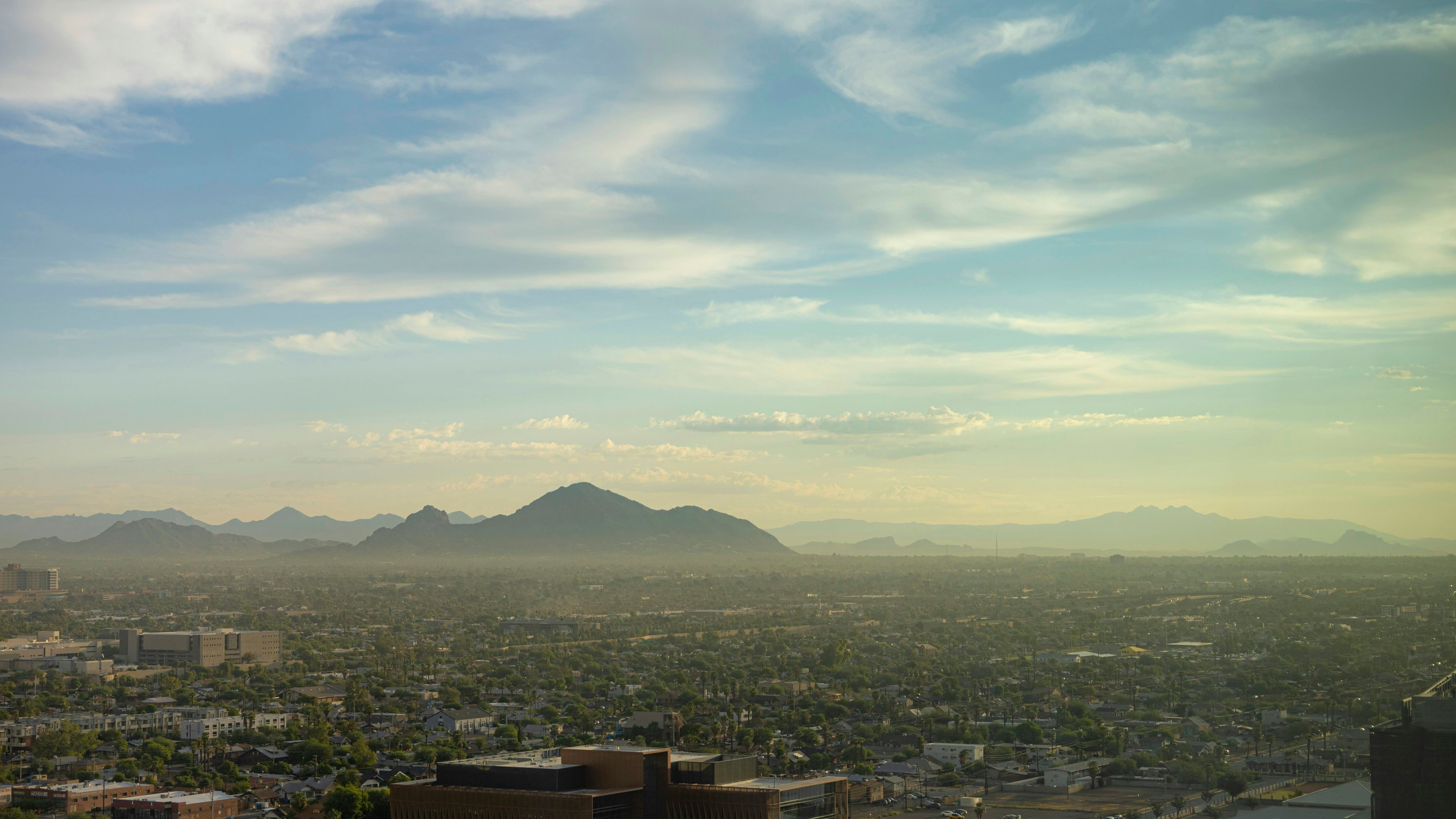 A view of a city with mountains in the background