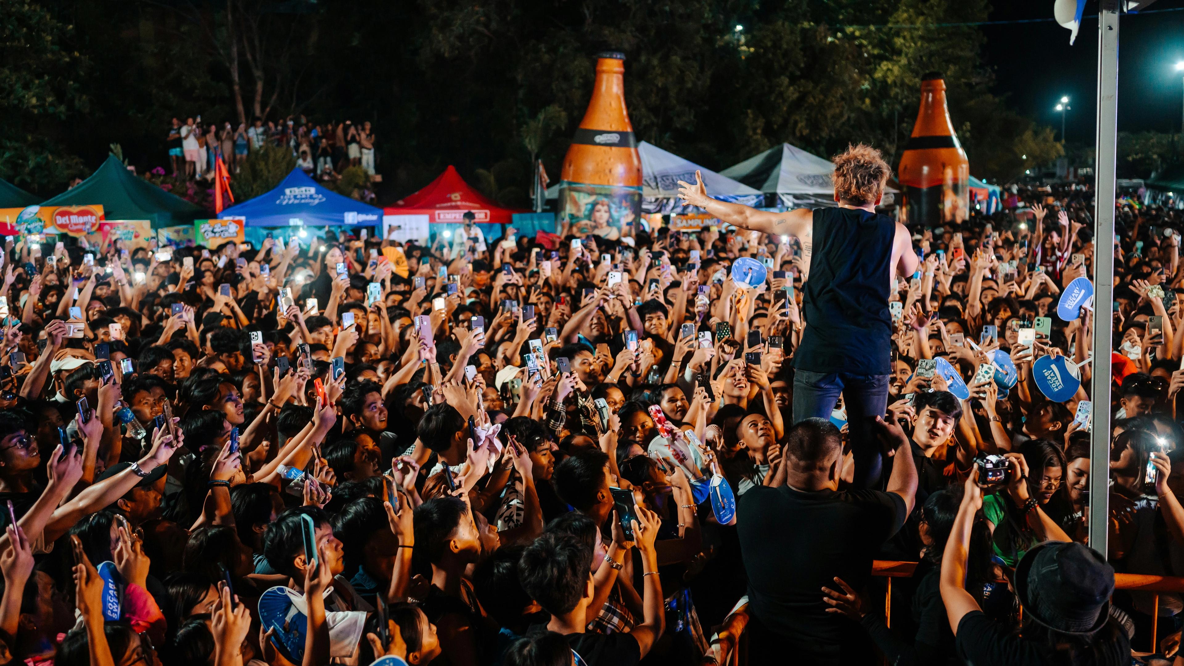 A man standing on top of a crowd of people