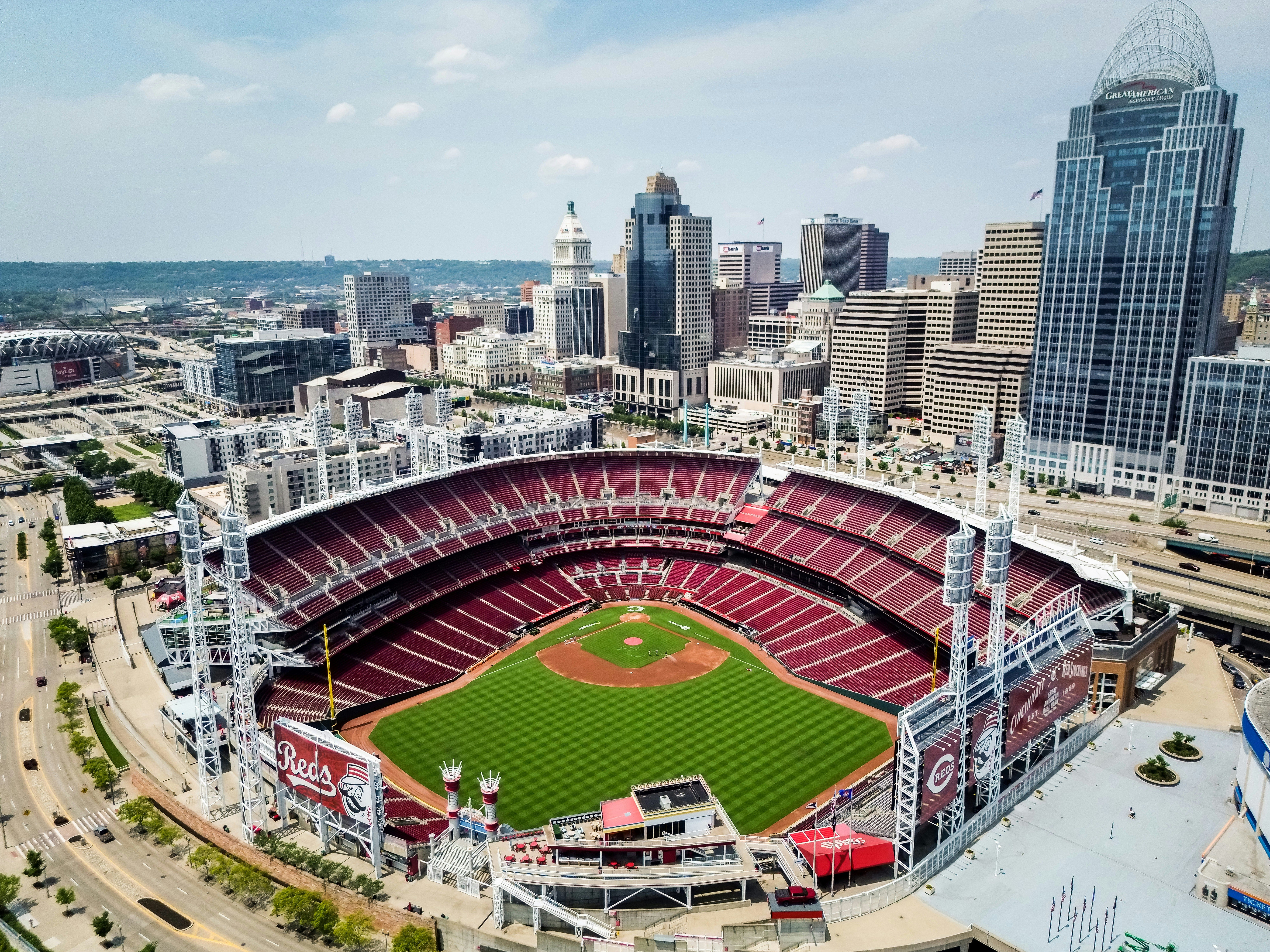 An aerial view of a baseball stadium in a city