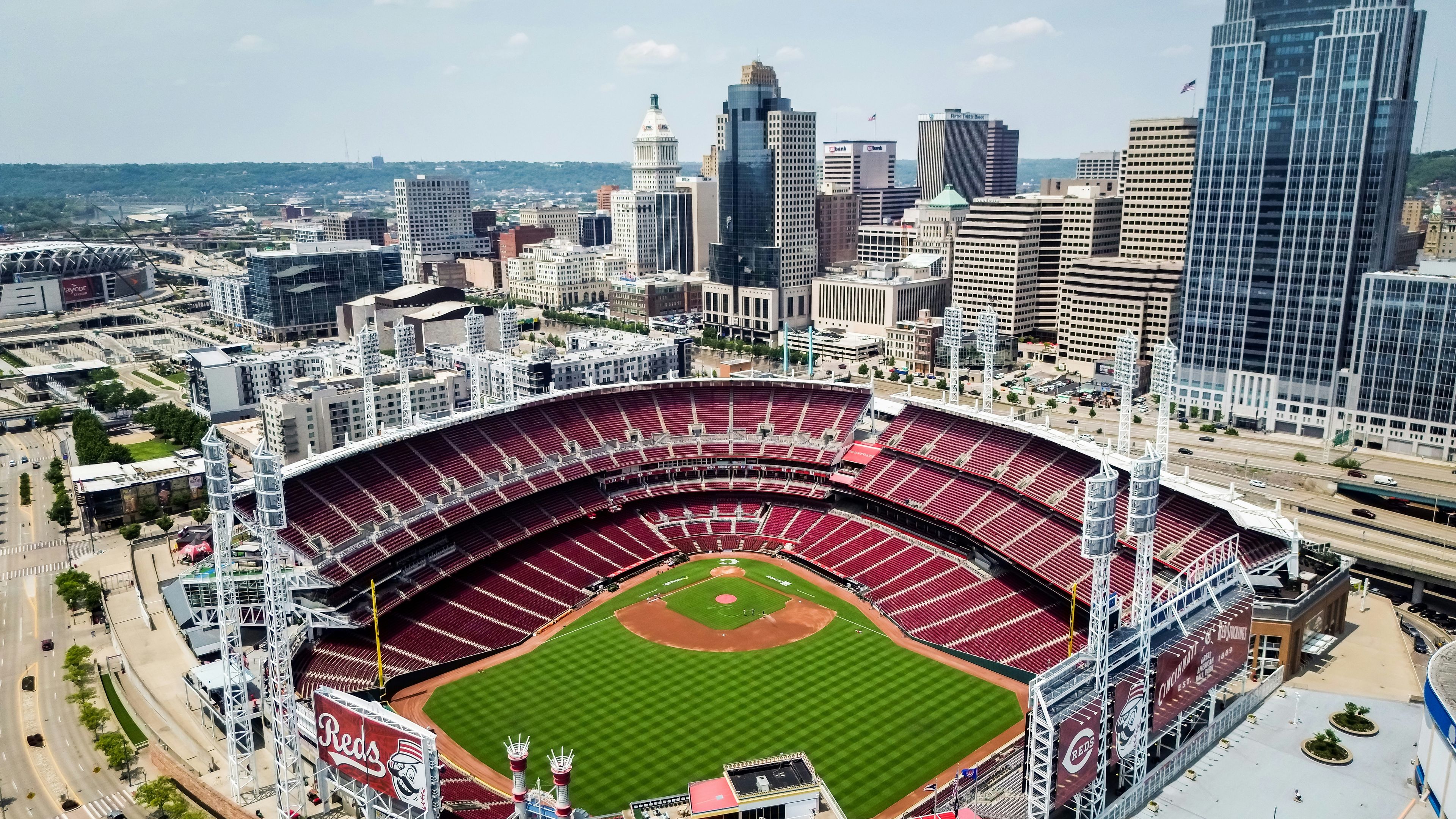 An aerial view of a baseball stadium in a city