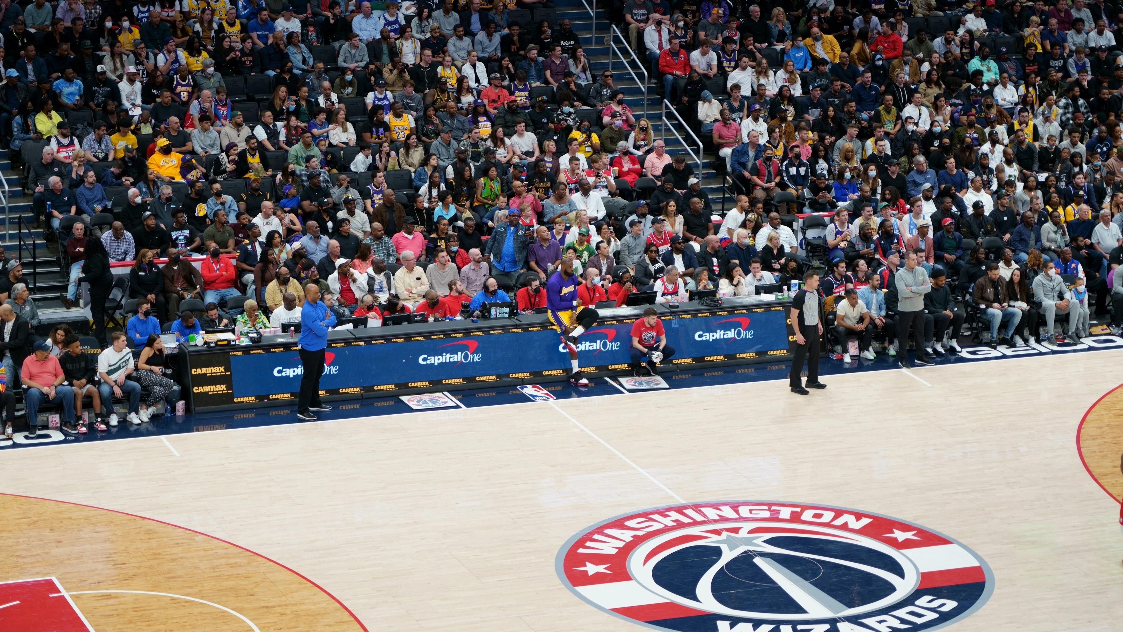 A crowd of people watching a basketball game