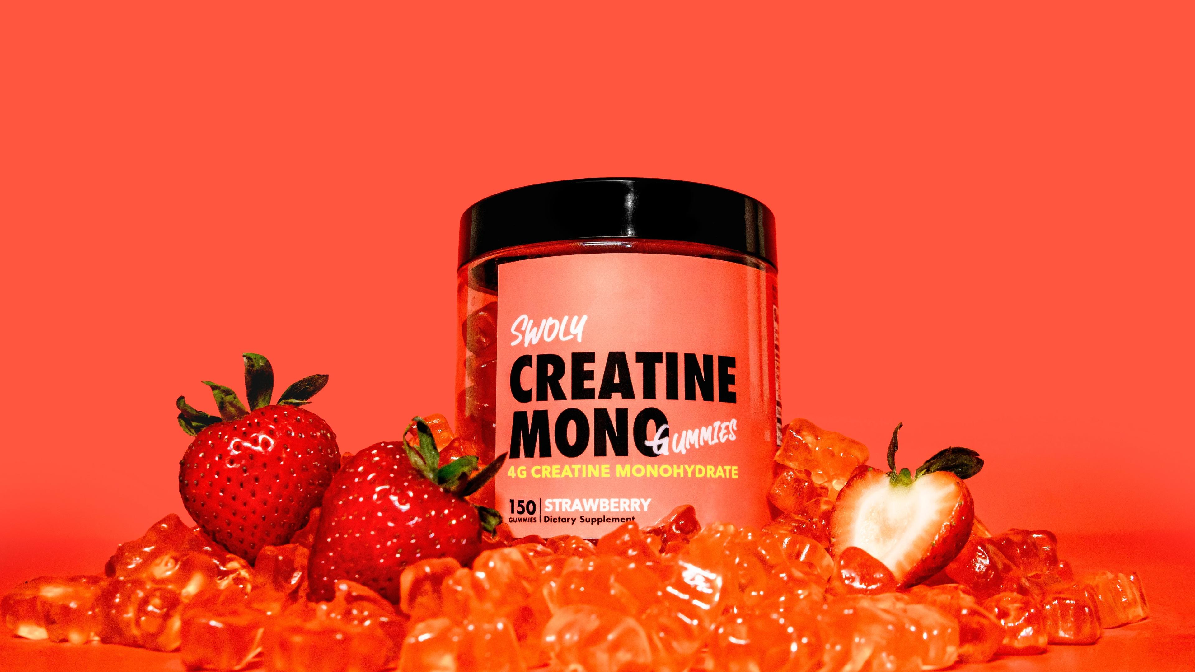 A jar of creatin monoc next to some strawberries