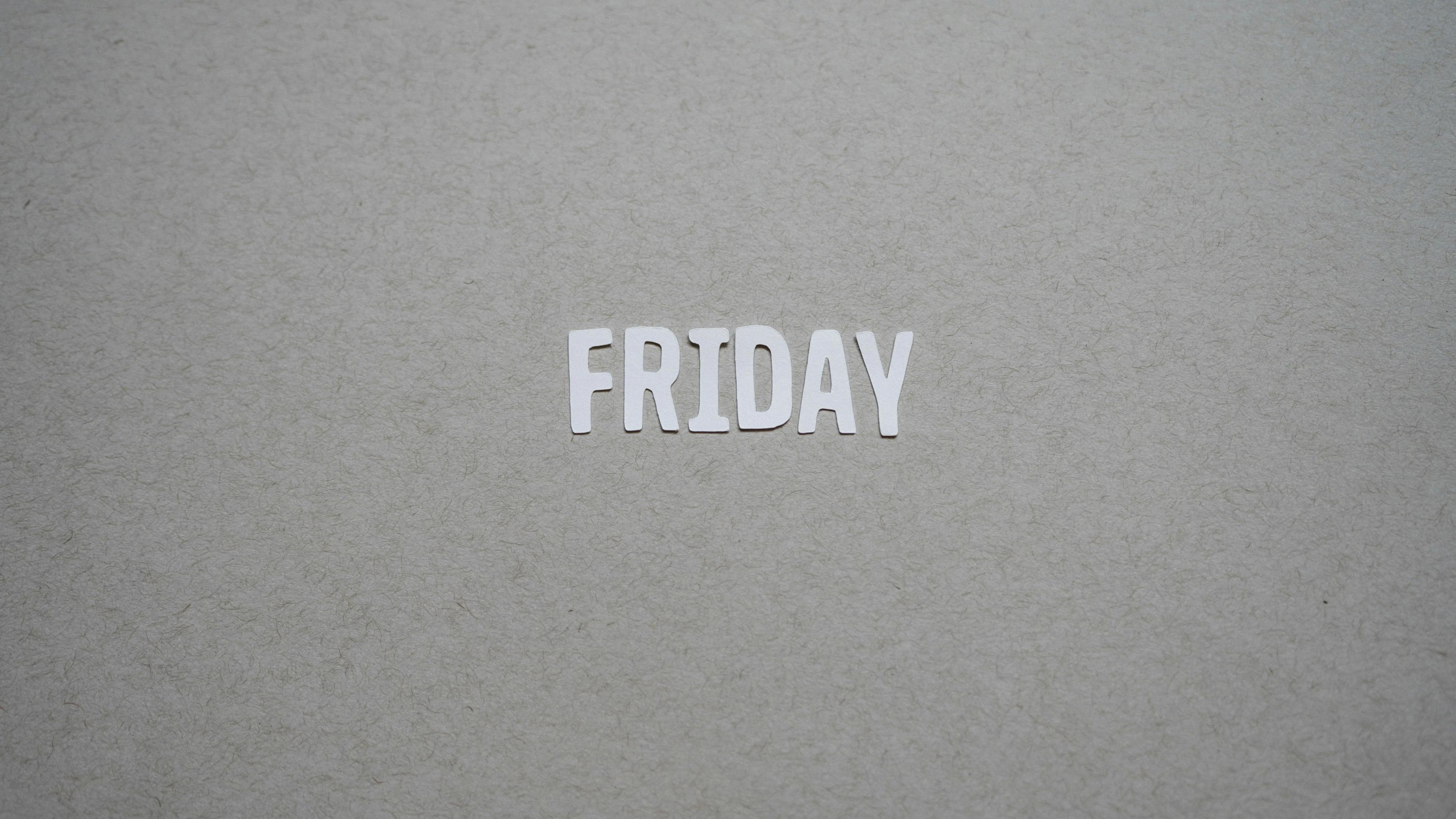 A close up of the word friday written on a piece of paper