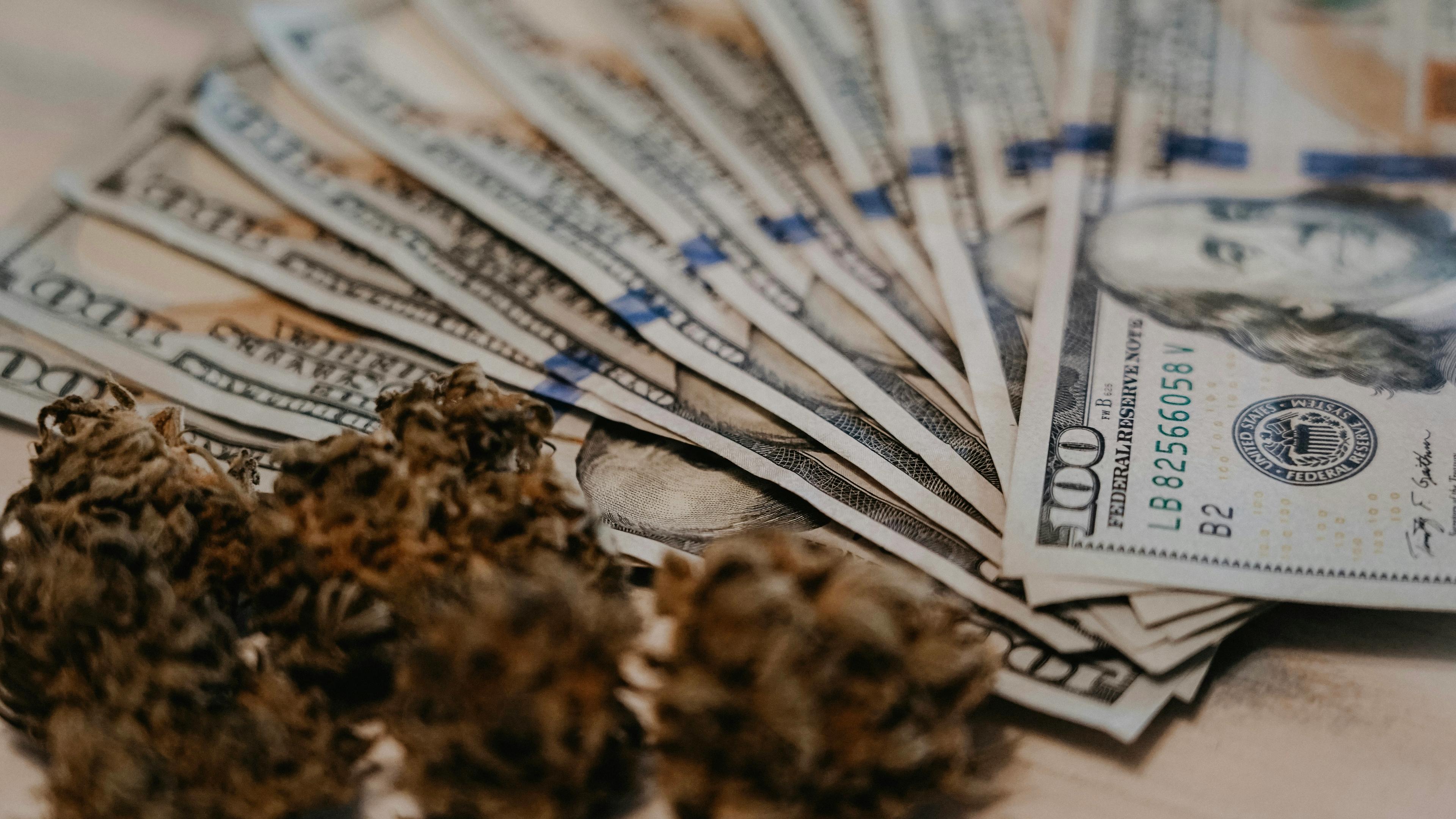 A pile of money sitting on top of a table