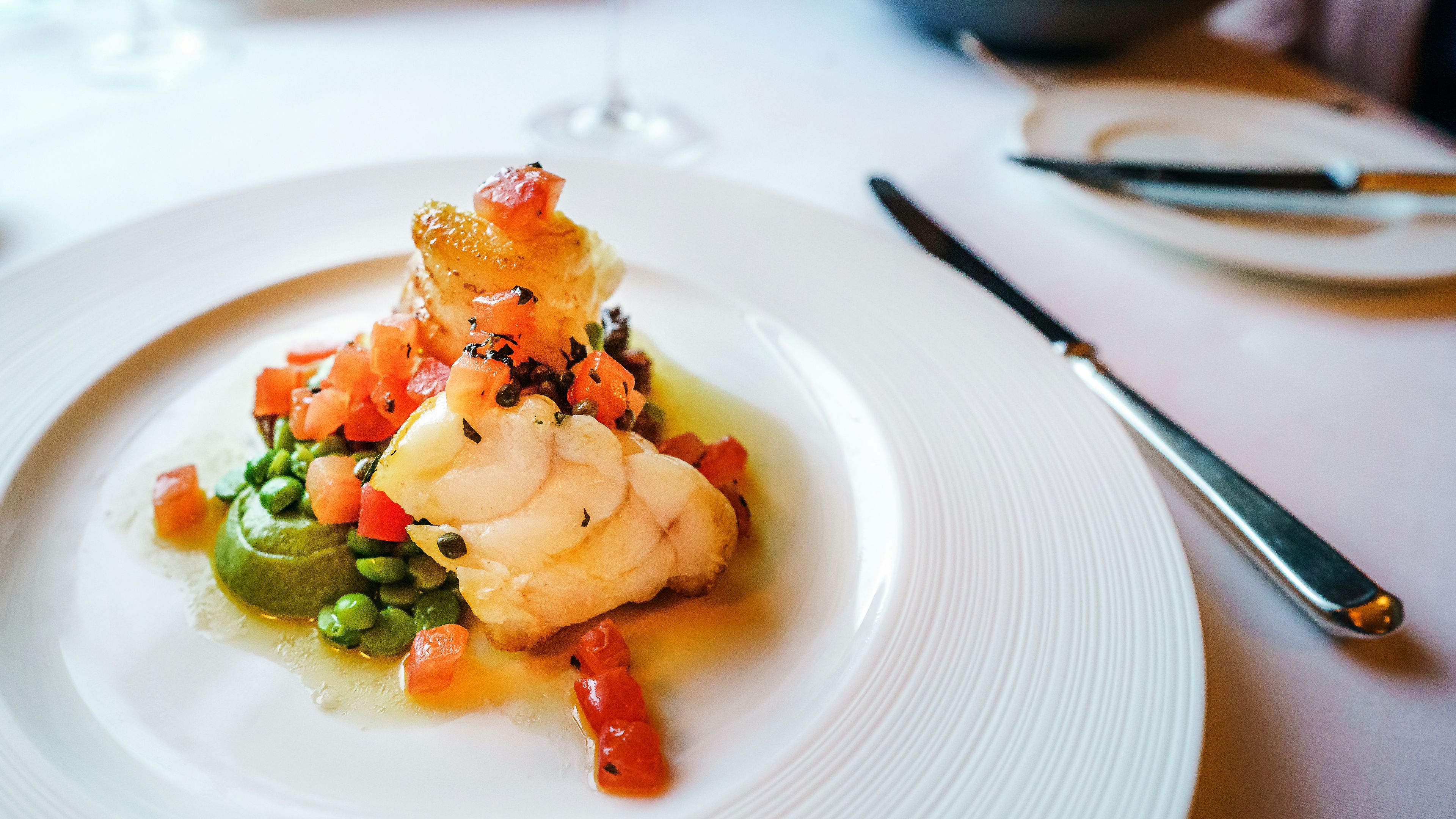 White ceramic plate with stainless steel fork