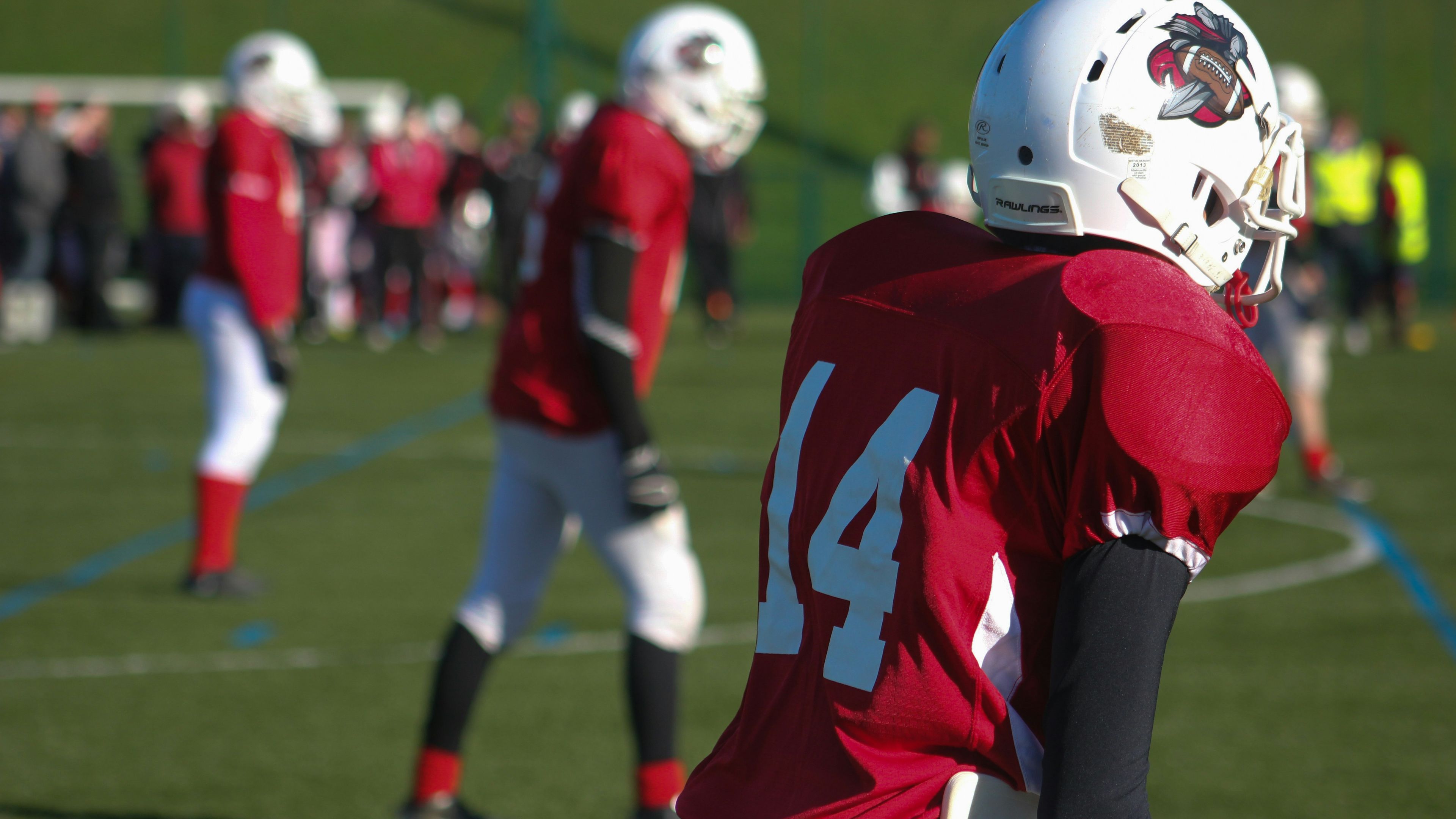 Selective focus photography of American football 14 player