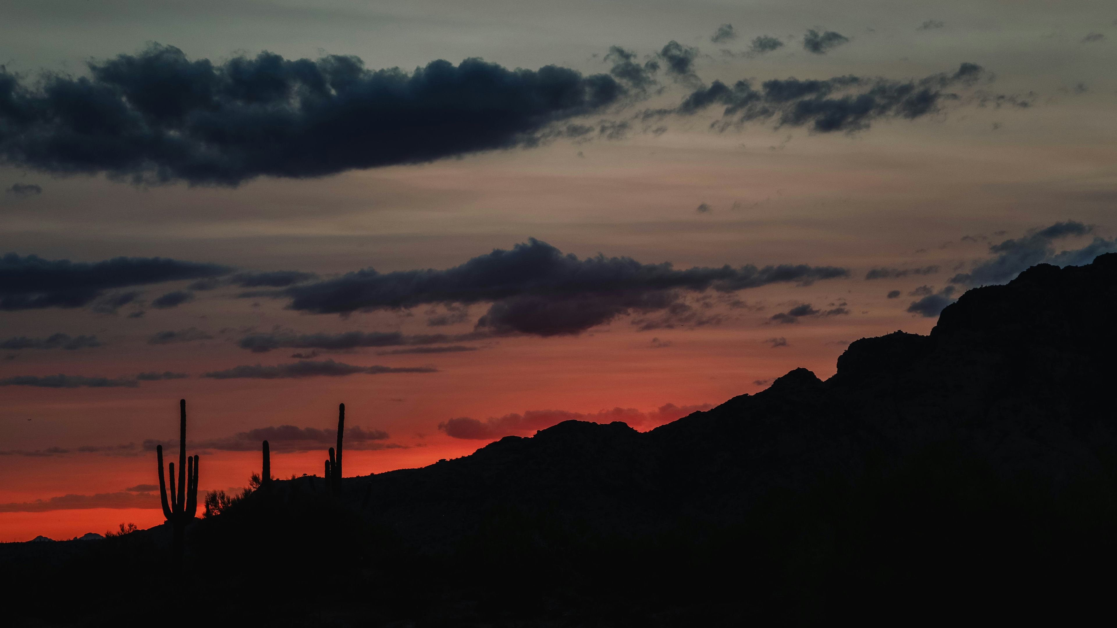 A sunset over a mountain