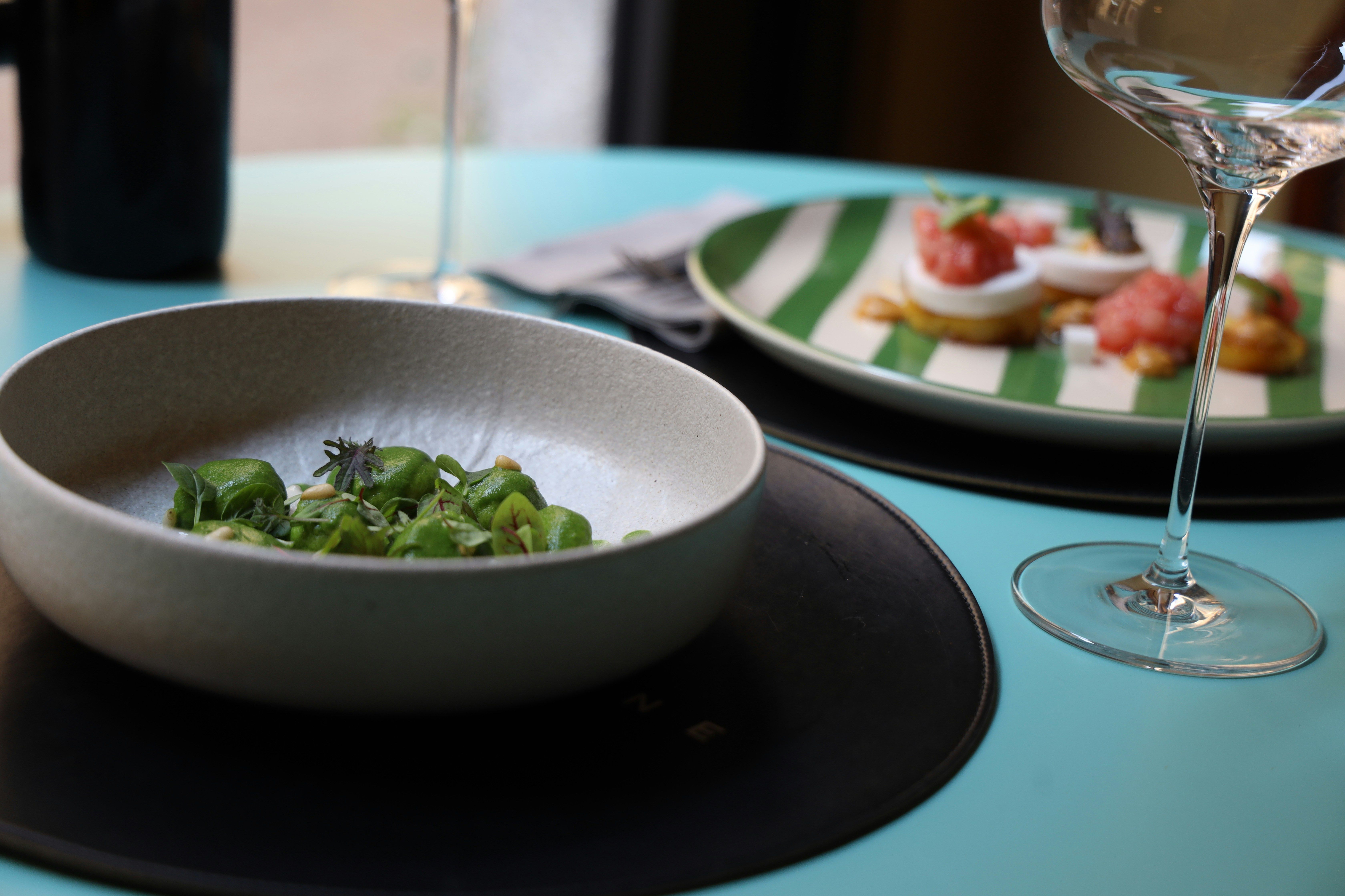 Green food in a bowl on a table