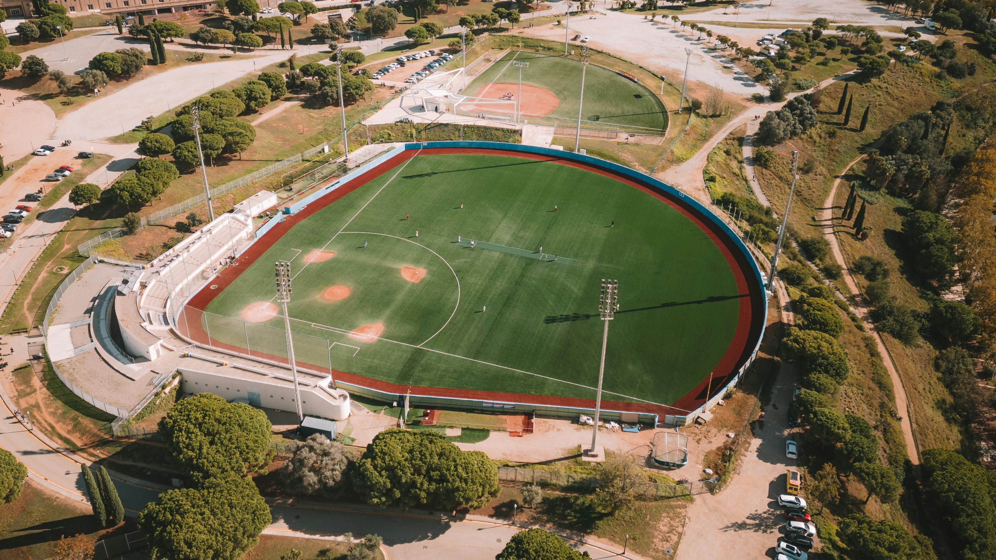An aerial view of a baseball field in a city