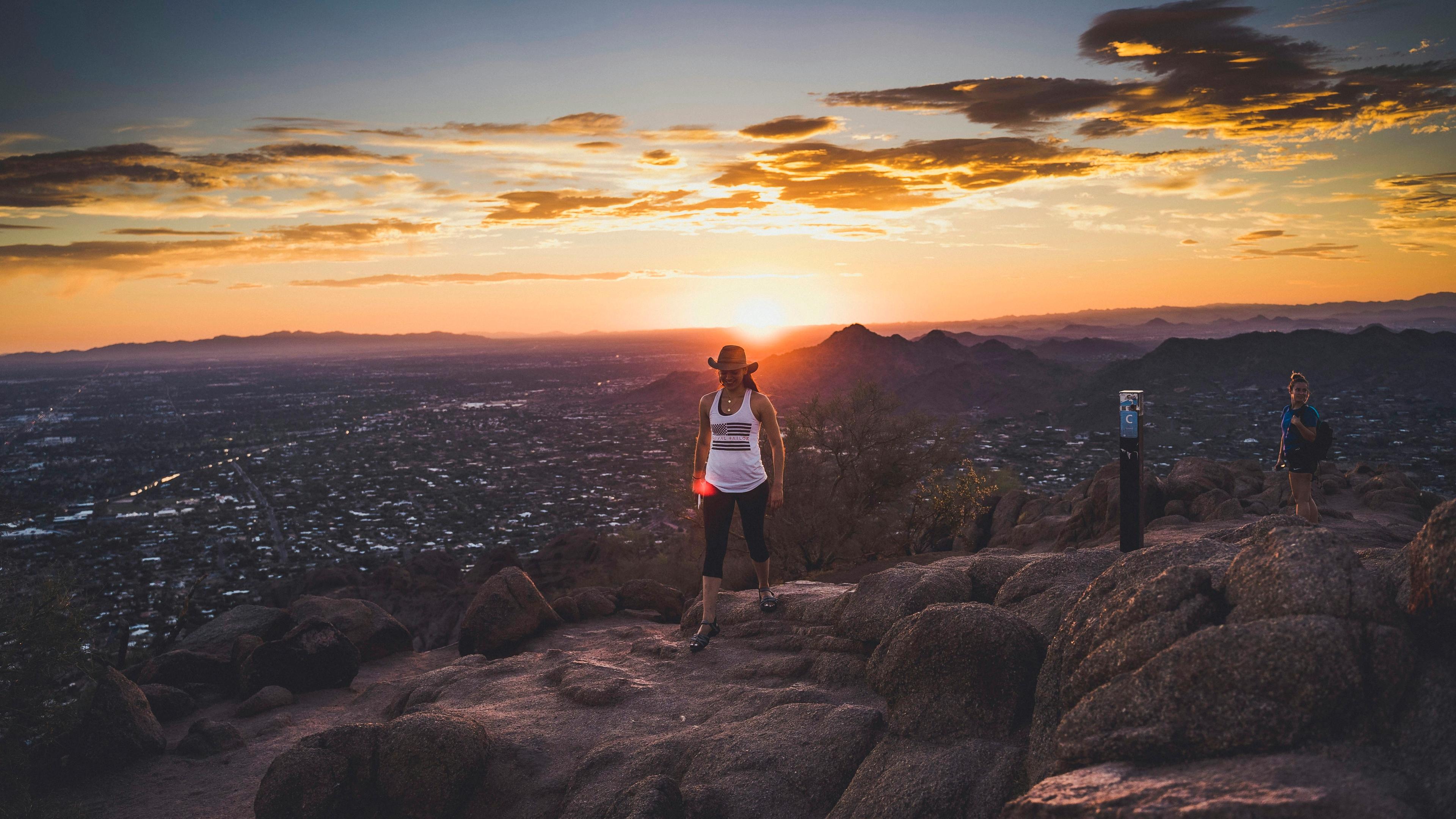A group of people standing on top of a mountain