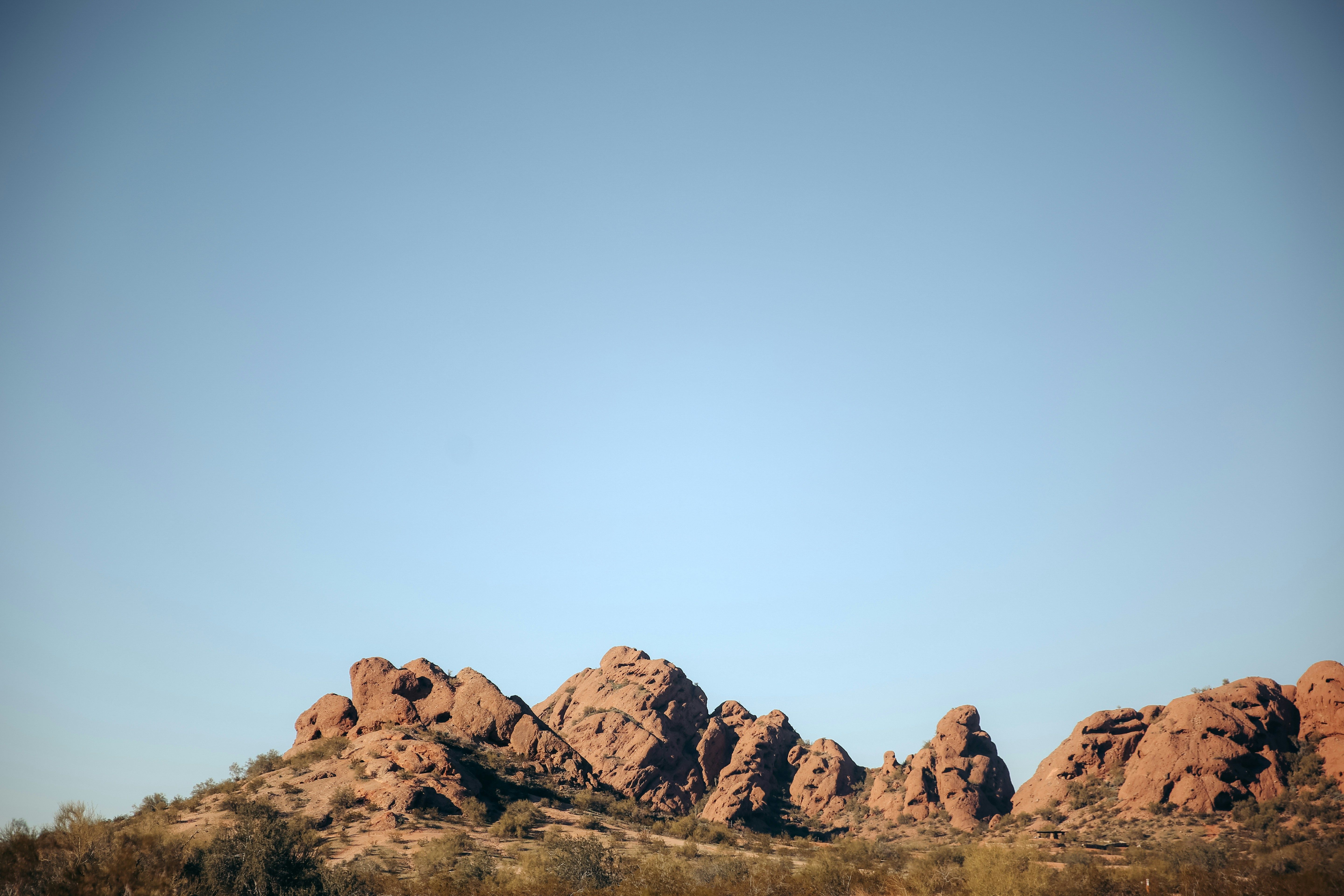 A group of rocks sitting in the middle of a desert