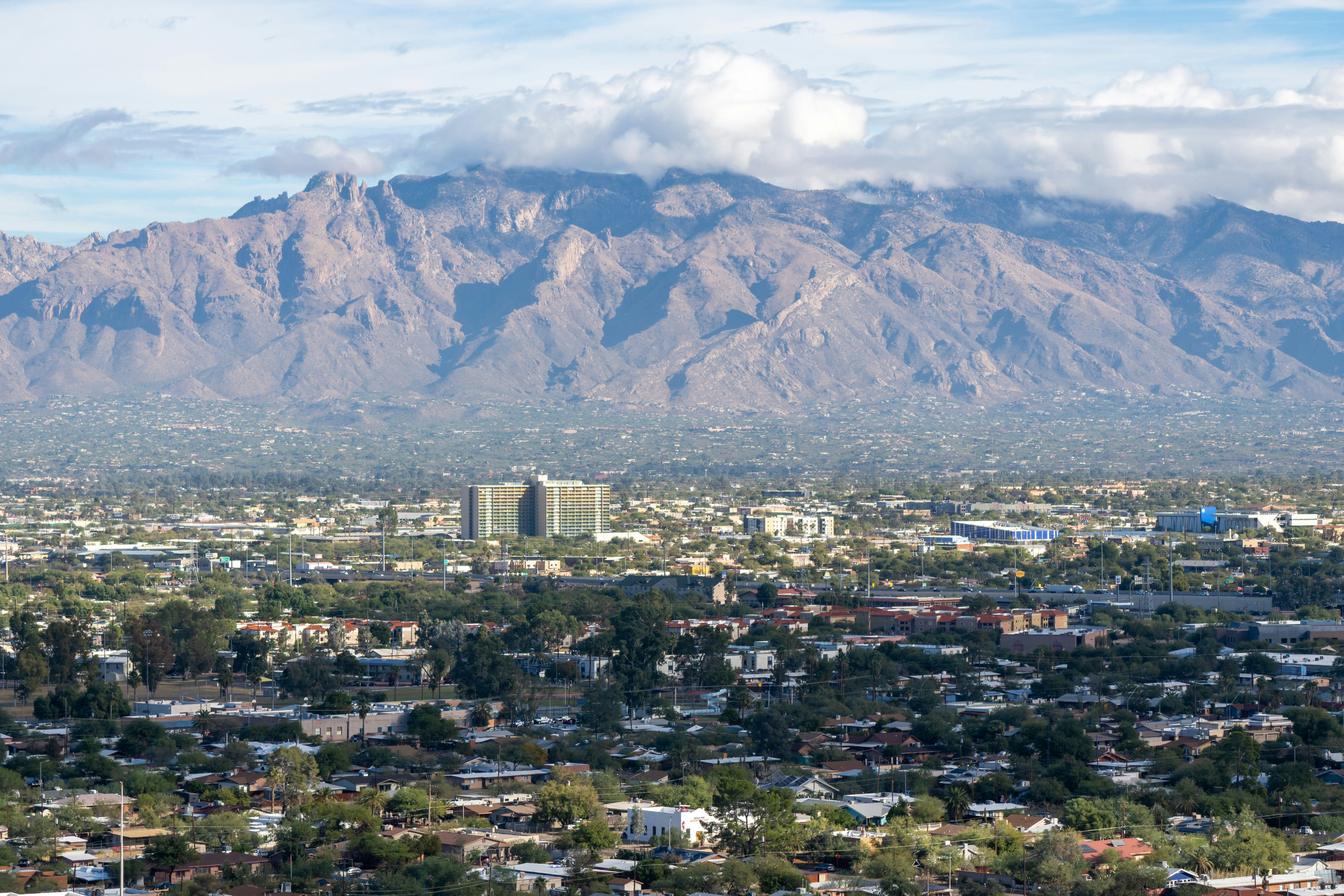A view of a city with mountains in the background