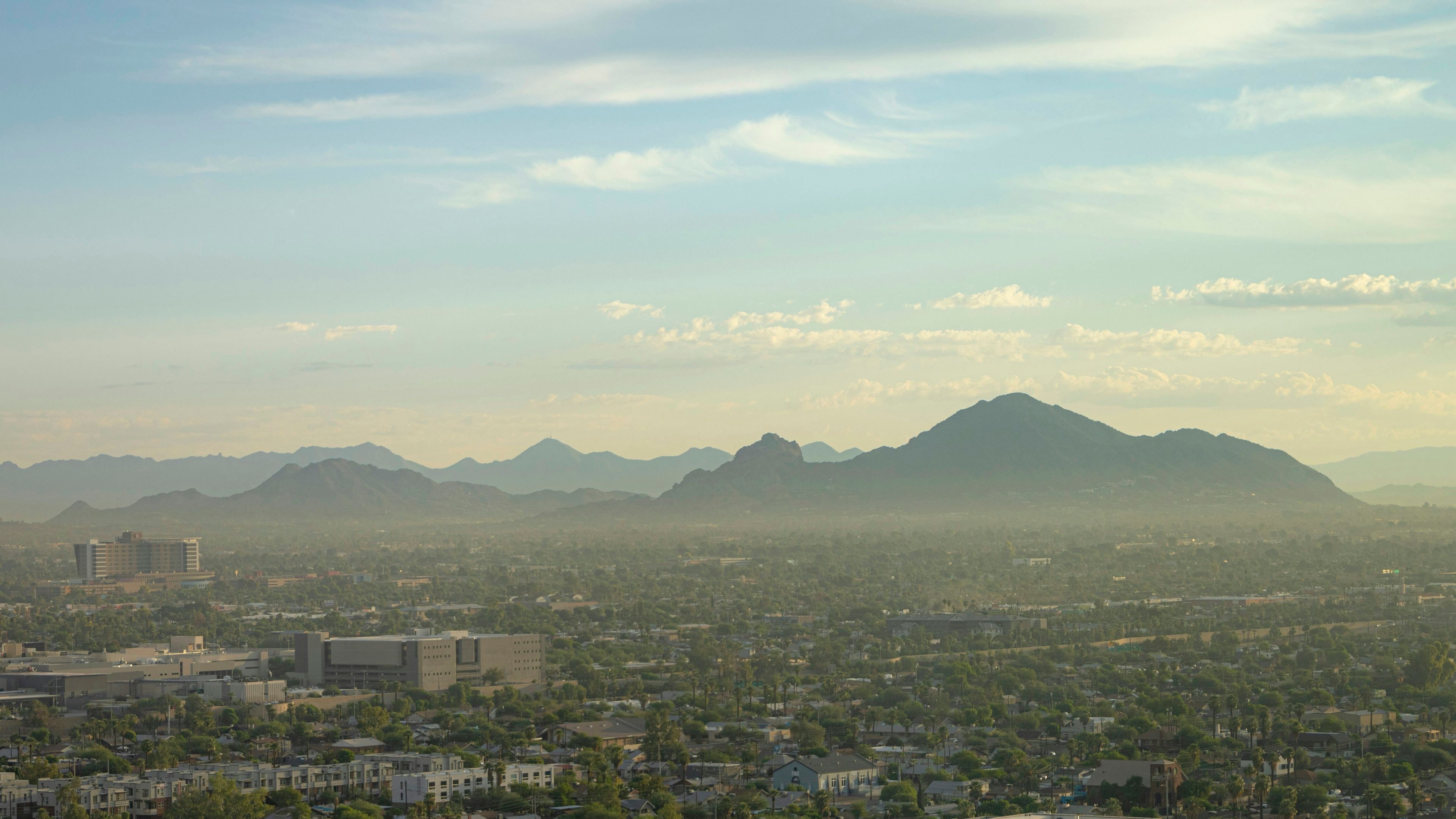 A view of a city with mountains in the background