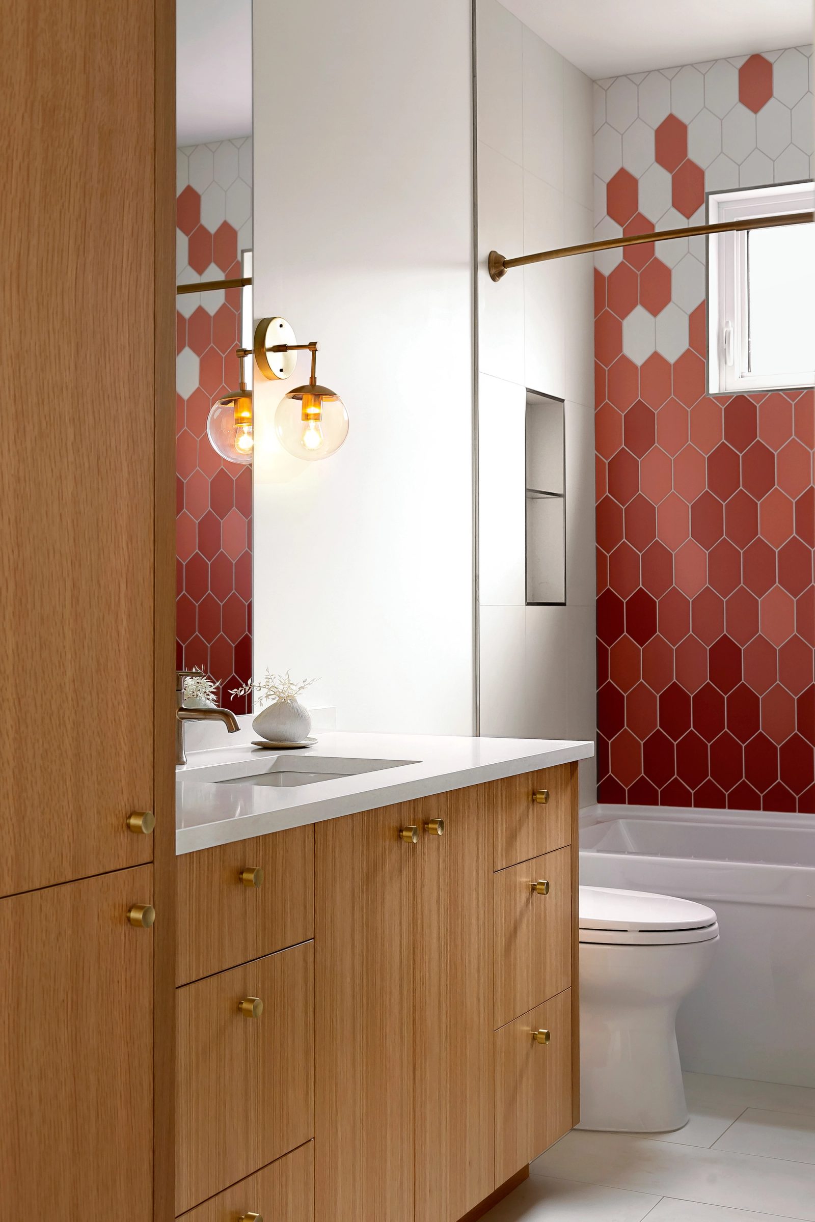 Bathroom with terracotta hexagonal tile, oak vanity and brass fittings