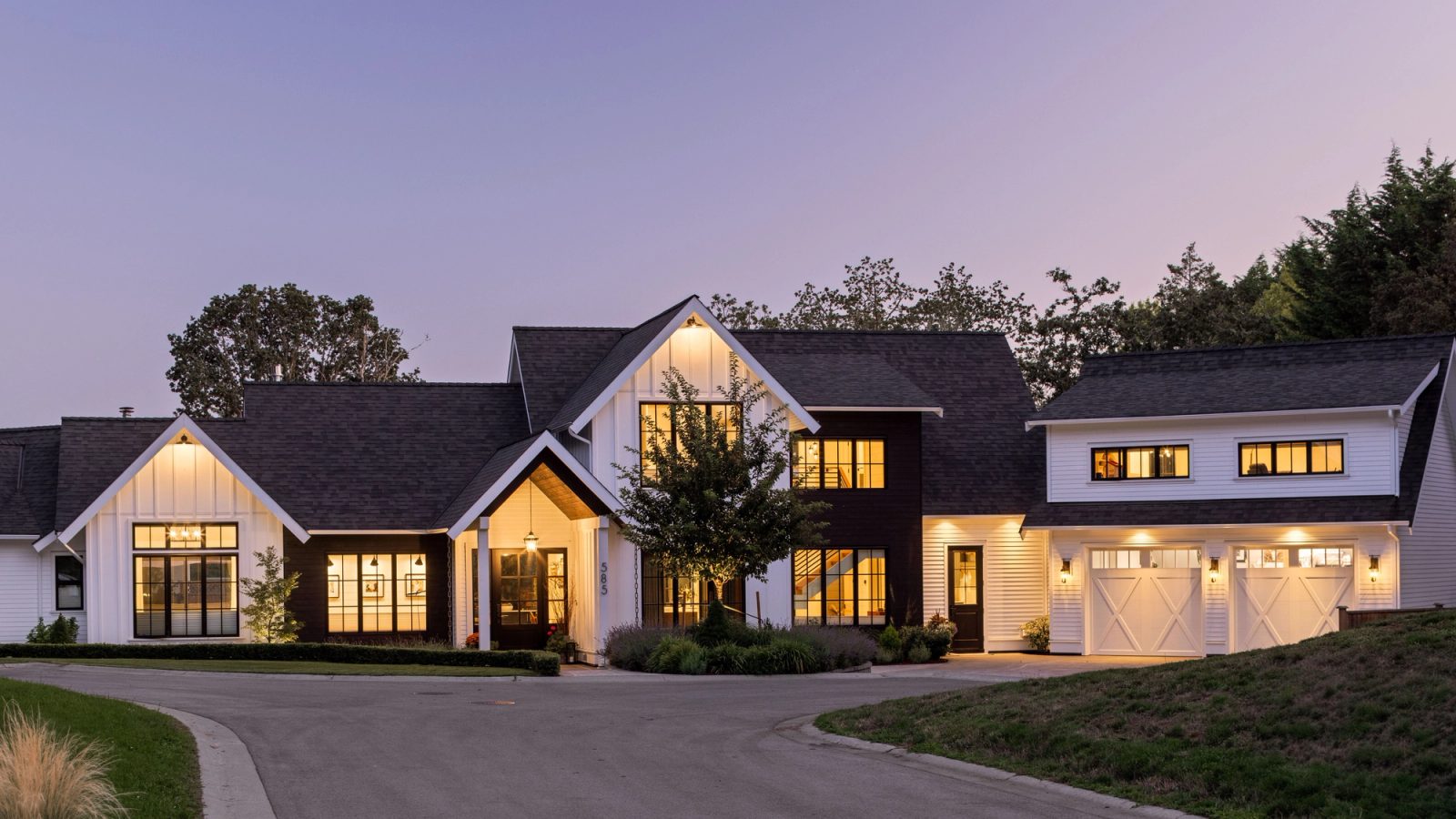 The property from the street at dusk.