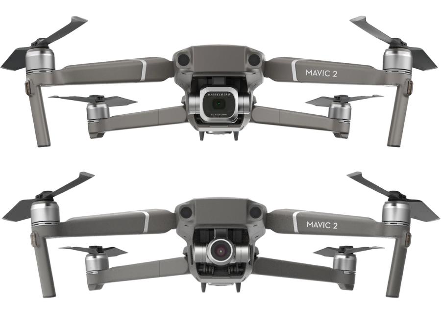 Two models of a silver drone with different size camera modules in the front.