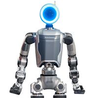 这是一个灰色和银色的两足机器人，圆头闪着蓝色光，手臂长，双手握握。