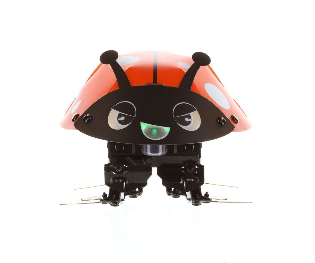 A spinning view of a small ladybug shaped robot composed of sheets folded together and held by rivets. It has 6 bent flipper legs.
