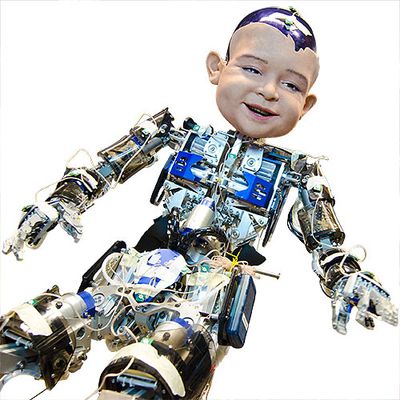 A child sized humanoid robot with exposed electronics in the torso, arms and legs, and an overly large expressive child's face.