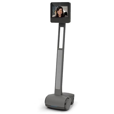 A wheeled telepresence robot with a display on top that shows a smiling woman.