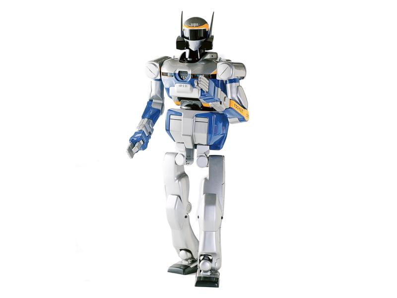 A bipedal humanoid robot with a blue, silver, black and yellow exterior and the appearance of wearing a helmet is posed standing with its arms and gripper fingers ready to act.