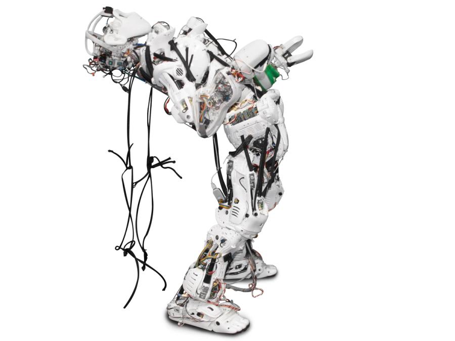 A white humanoid robot arches its "spine" so that it appears to be beginning to do a back bend.
