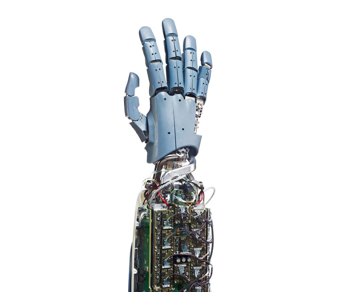 A series of images rotates a human-like robotic hand with five jointed fingers, which close into a fist and reopen.