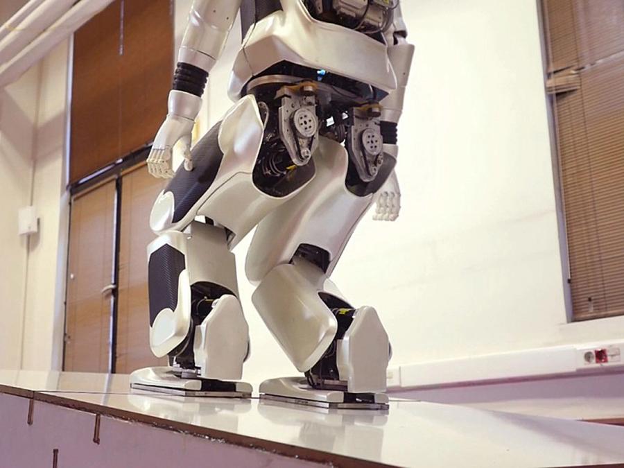 The robot can walk up and down stairs and ramps.