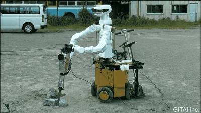 Space robot GITAI G1, a humanoid with a white metal body with a sensor-packed head and articulated arms, mounted on a omini wheel base, operates a jackhammer, breaking rocks on a parking lot.
