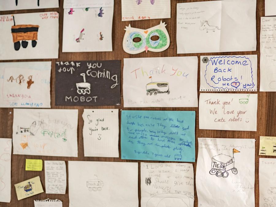 A wall of art from children dedicated to the robot.